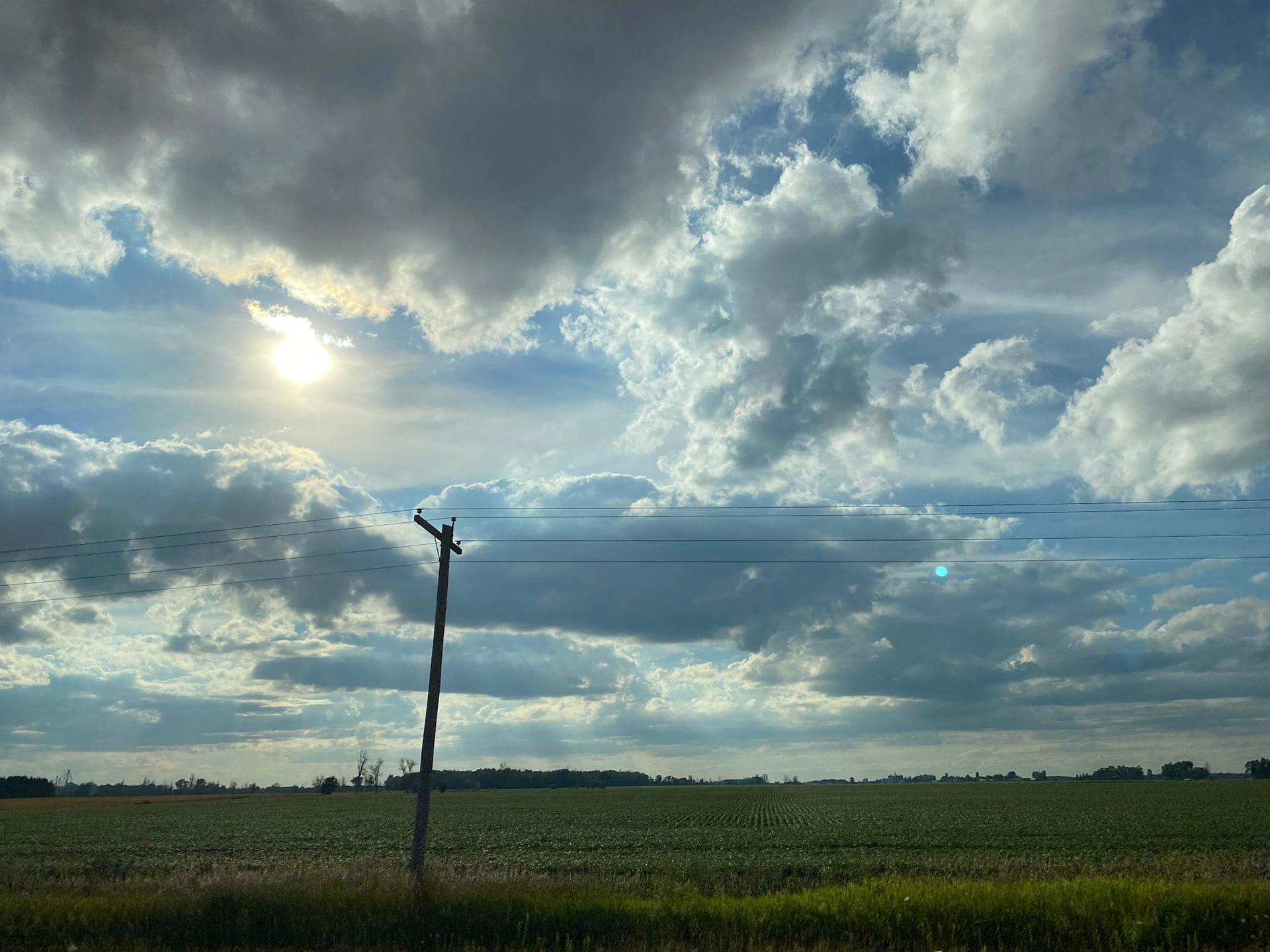 Sun and clouds and sunset during ride to the cottage - July 28-2022