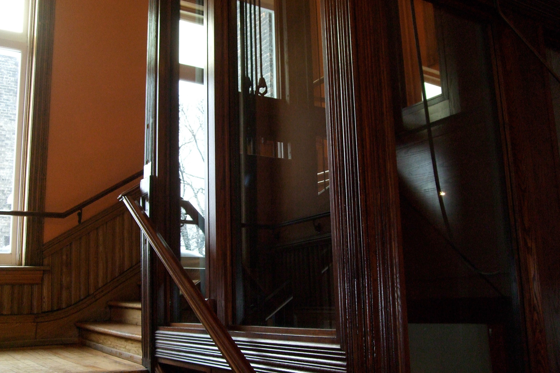 The staircase wraps around the elevator