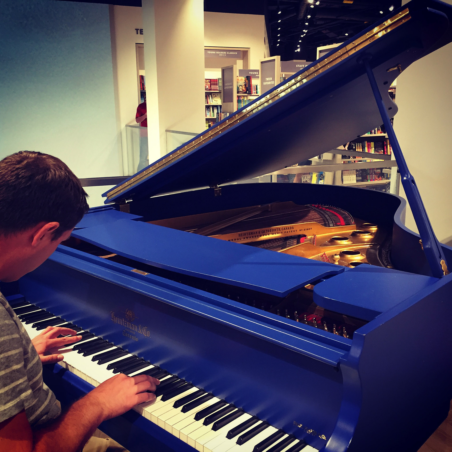 A blue grand piano at Indigo Sherway