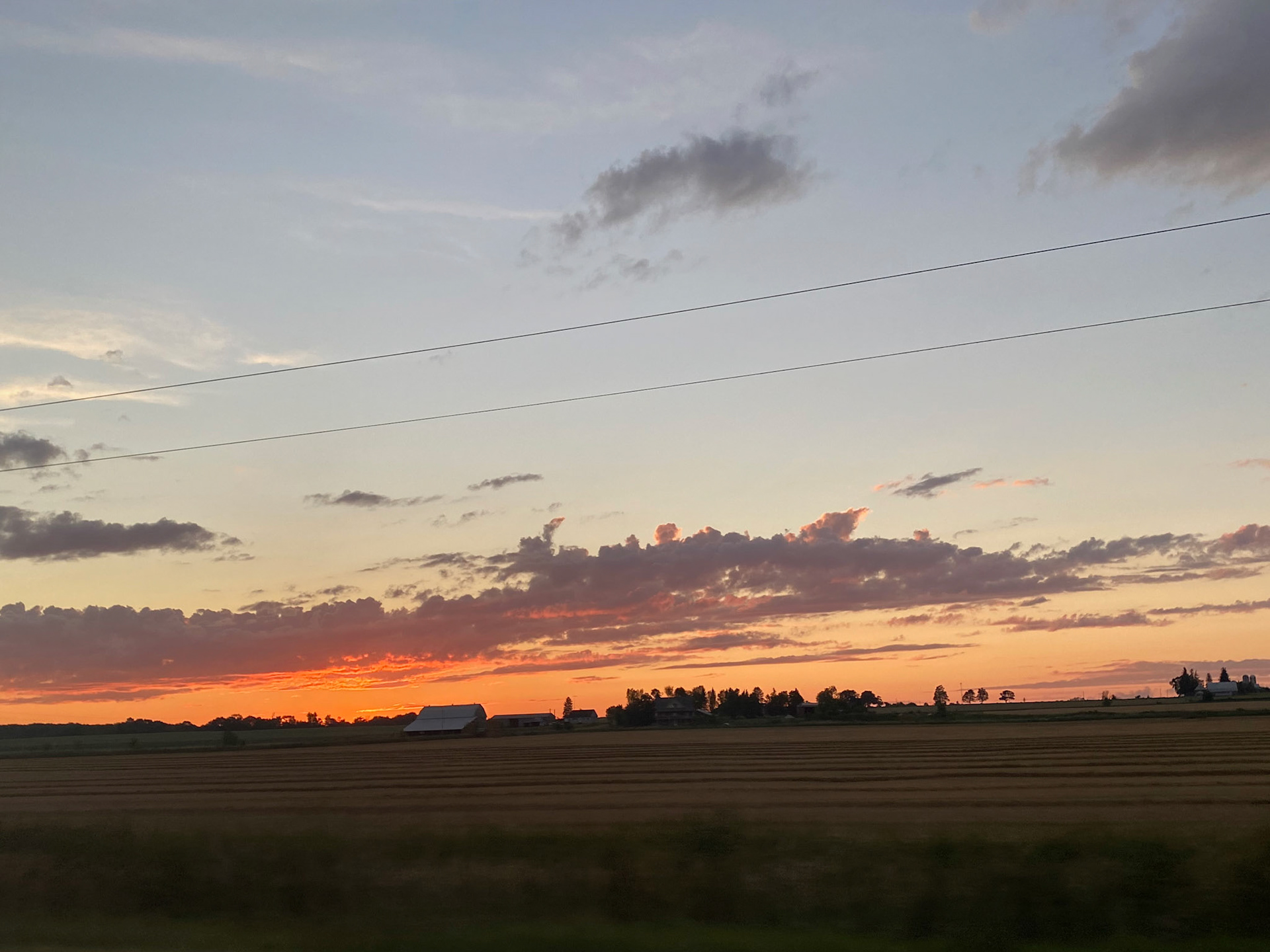 Sun and clouds and sunset during ride to the cottage - July 28-2022