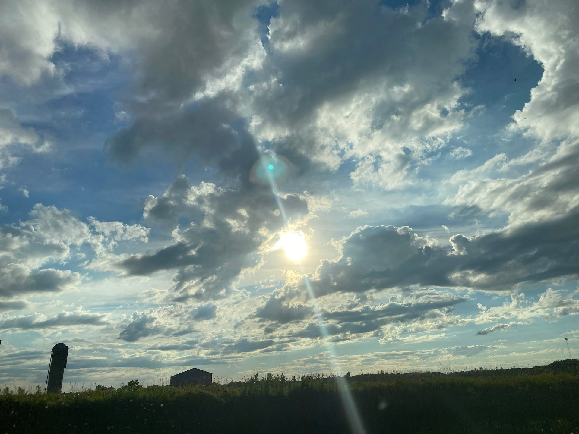 Sun and clouds and sunset during ride to the cottage - July 28-2022