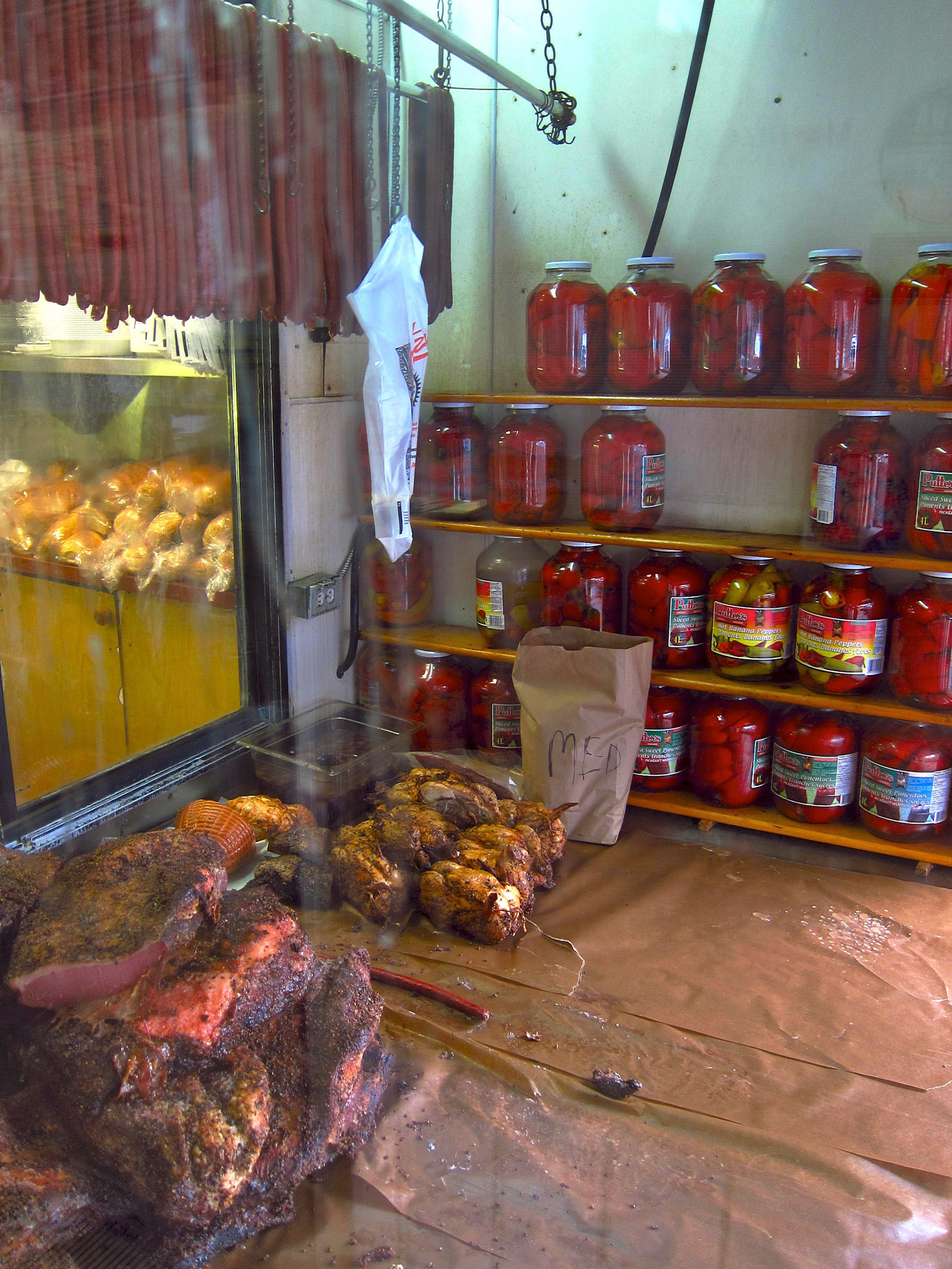 Schwartz smoked meat cures in the shop window