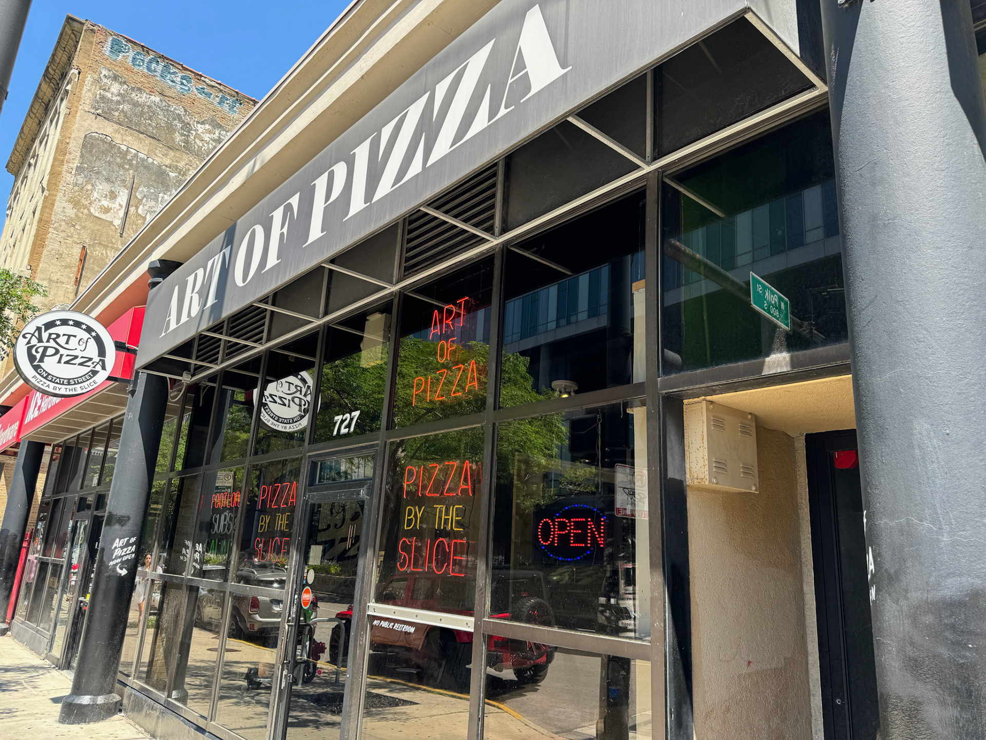 Art of Pizza sells Chicago-style deep dish pizza by the slice, and is about as far from a tourist trap as you can imagine