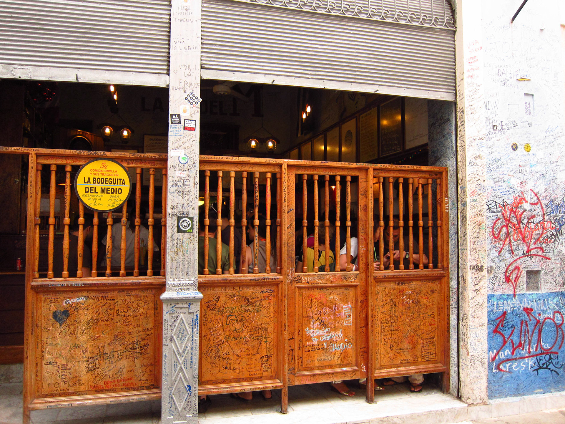 A bar in Havana where many visitors have signed their names/etc.