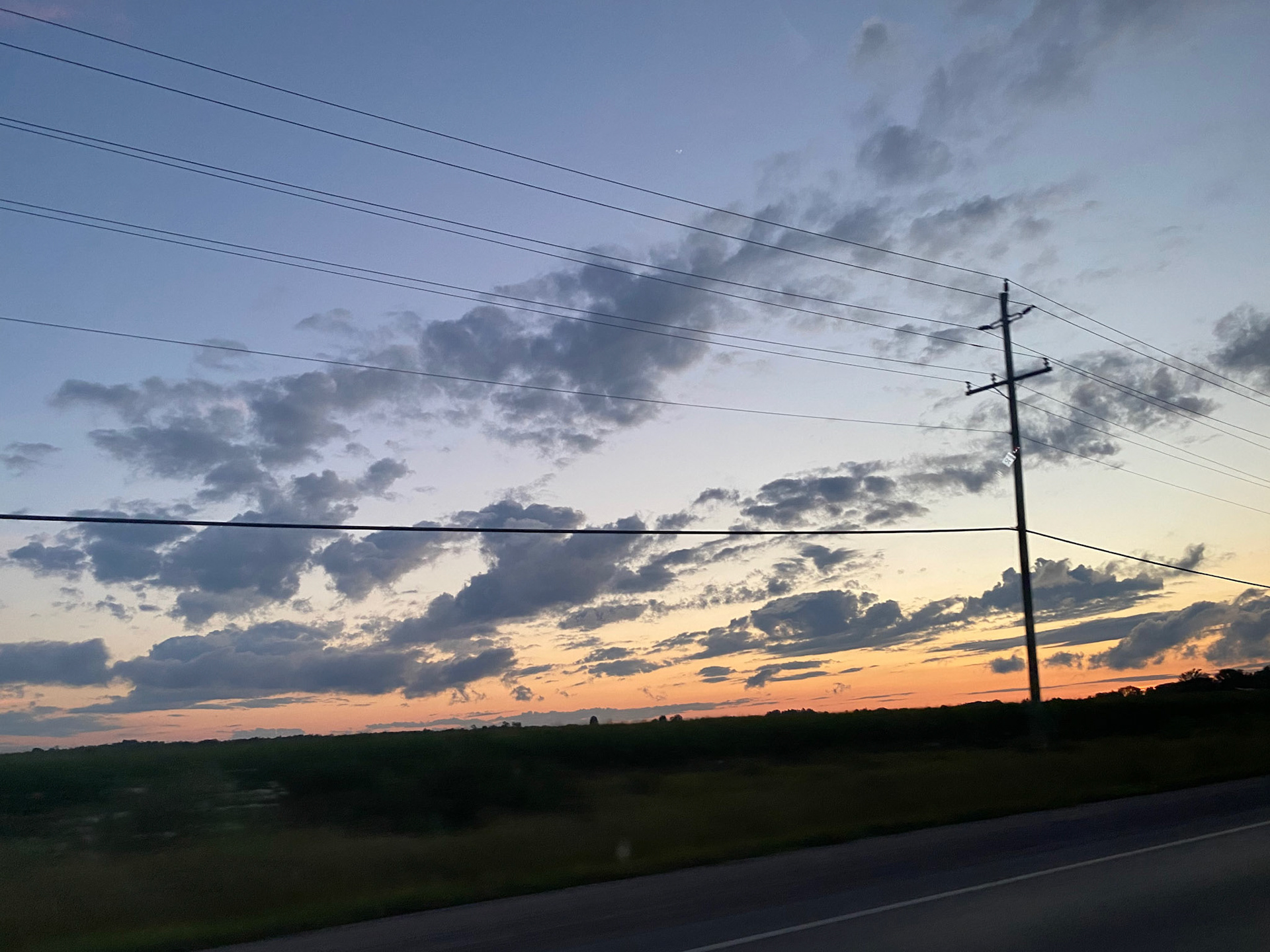 Sun and clouds and sunset during ride to the cottage - July 28-2022