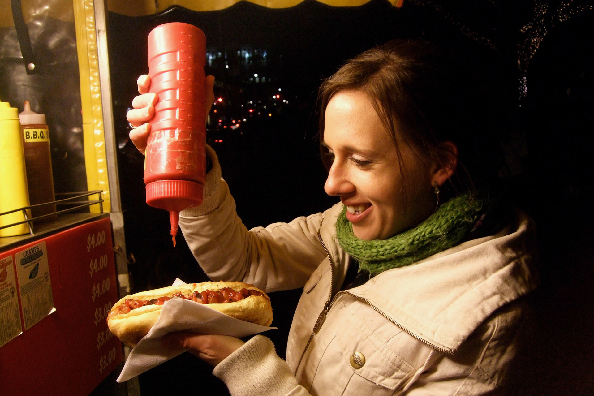 After we froze watching the fireworks, Kelly and I got some street meat. I don't think she could look more excited
