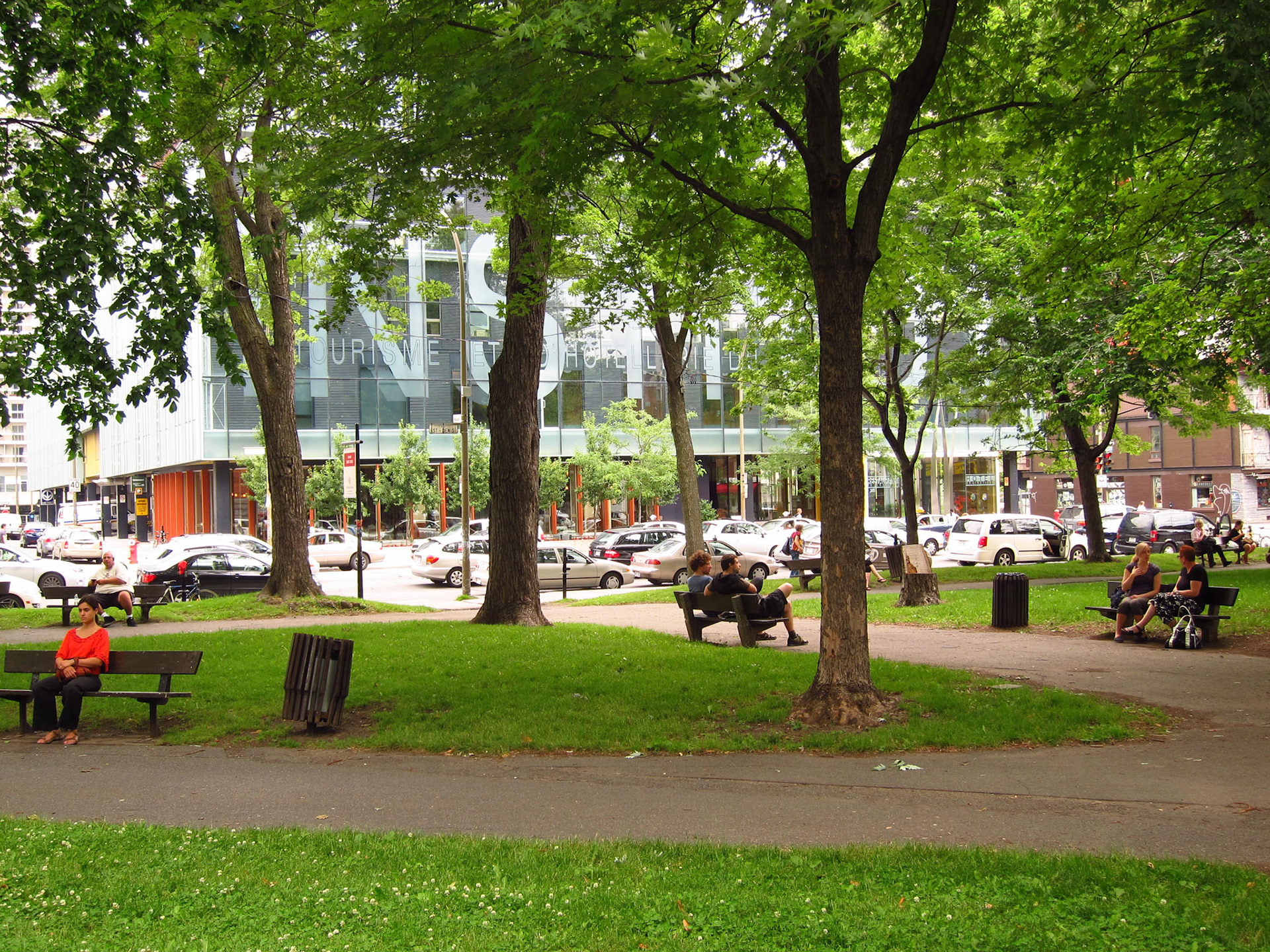 Relaxing under the green leaves in a park near the Latin Quarter