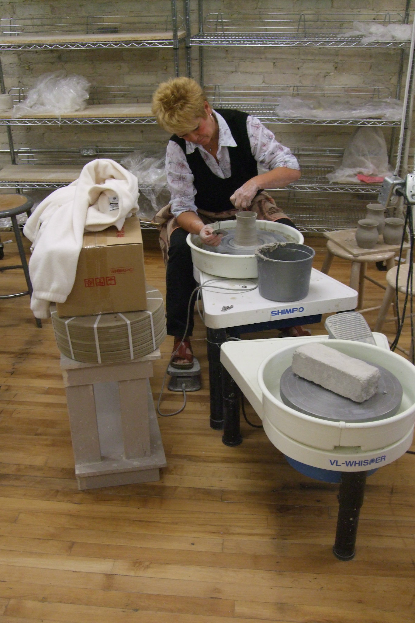 An artist at work at the Clay Art Centre