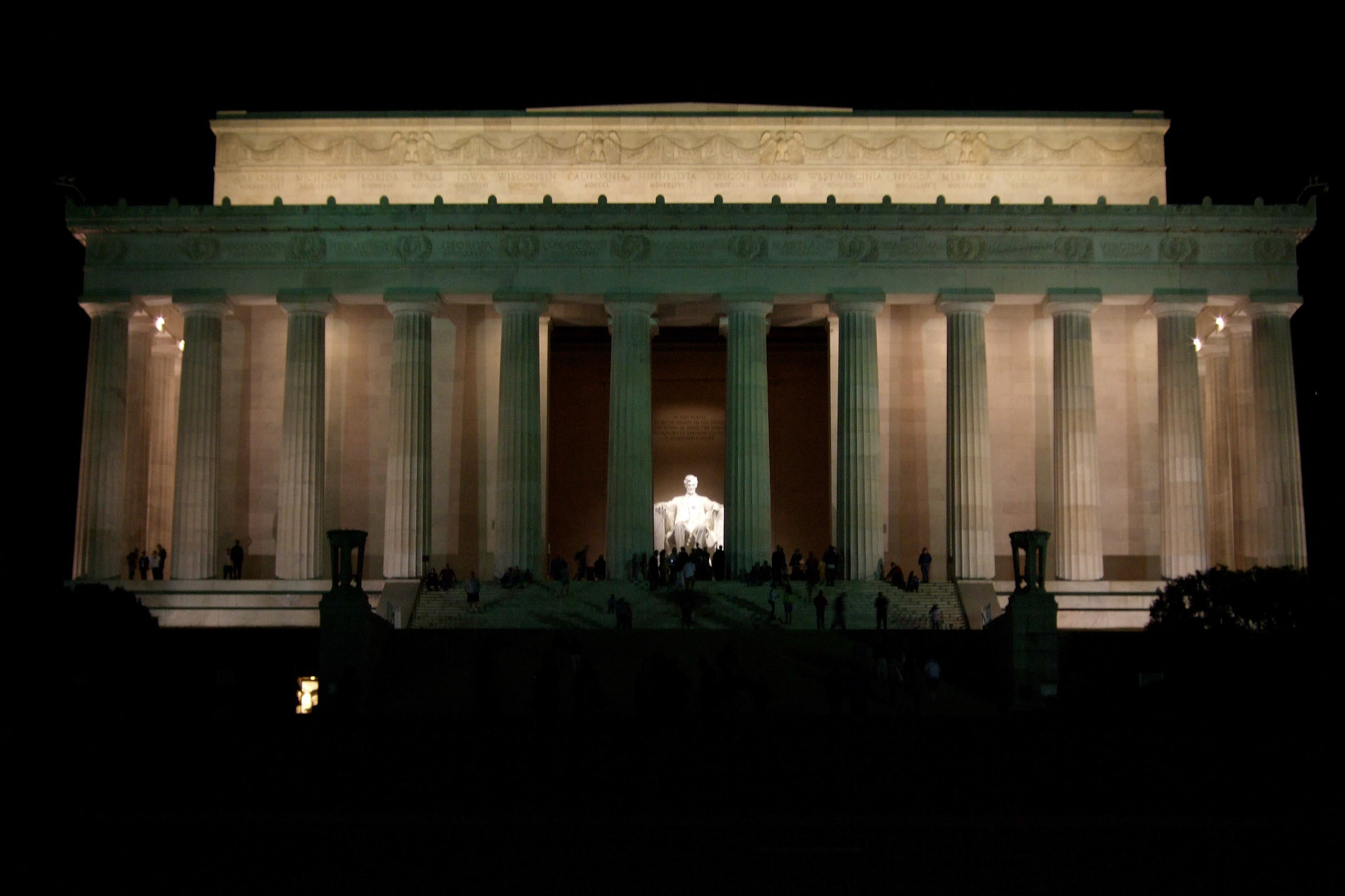 At the end of the reflecting pool, the Lincoln Memorial - all lit up at night