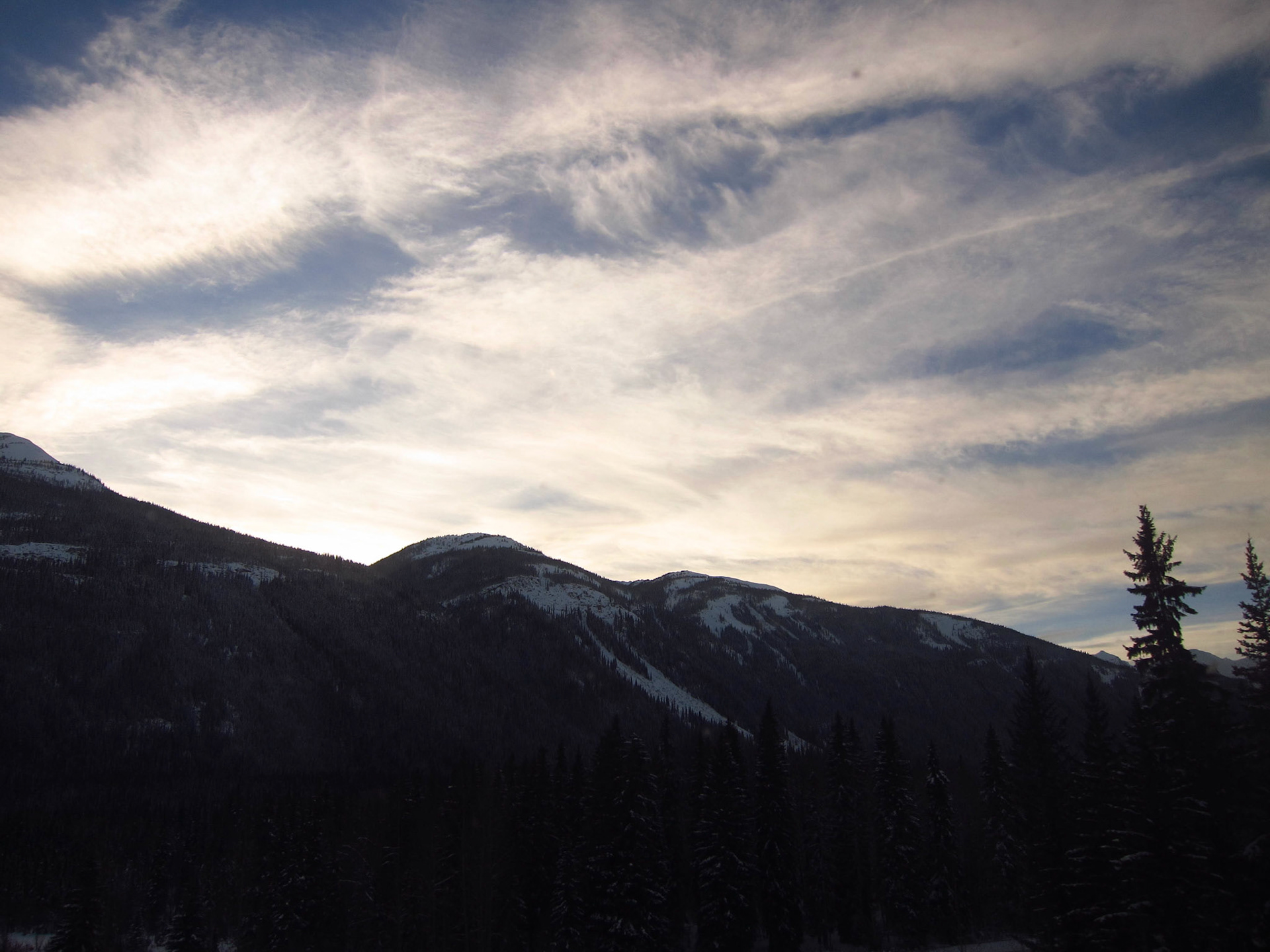 Perfect skies and clouds as we pass through The Rockies