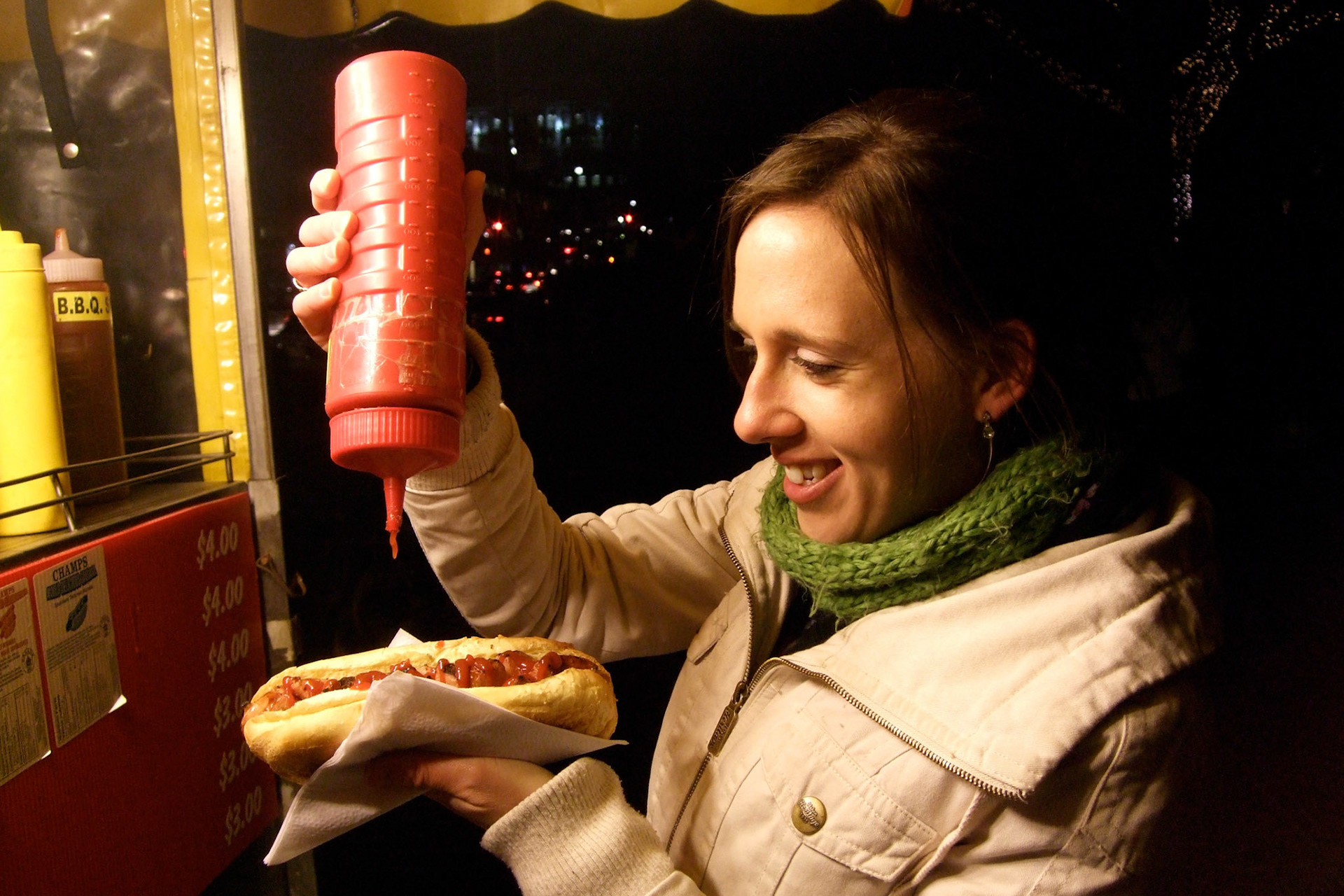 After we froze watching the fireworks, Kelly and I got some street meat. I don't think she could look more excited