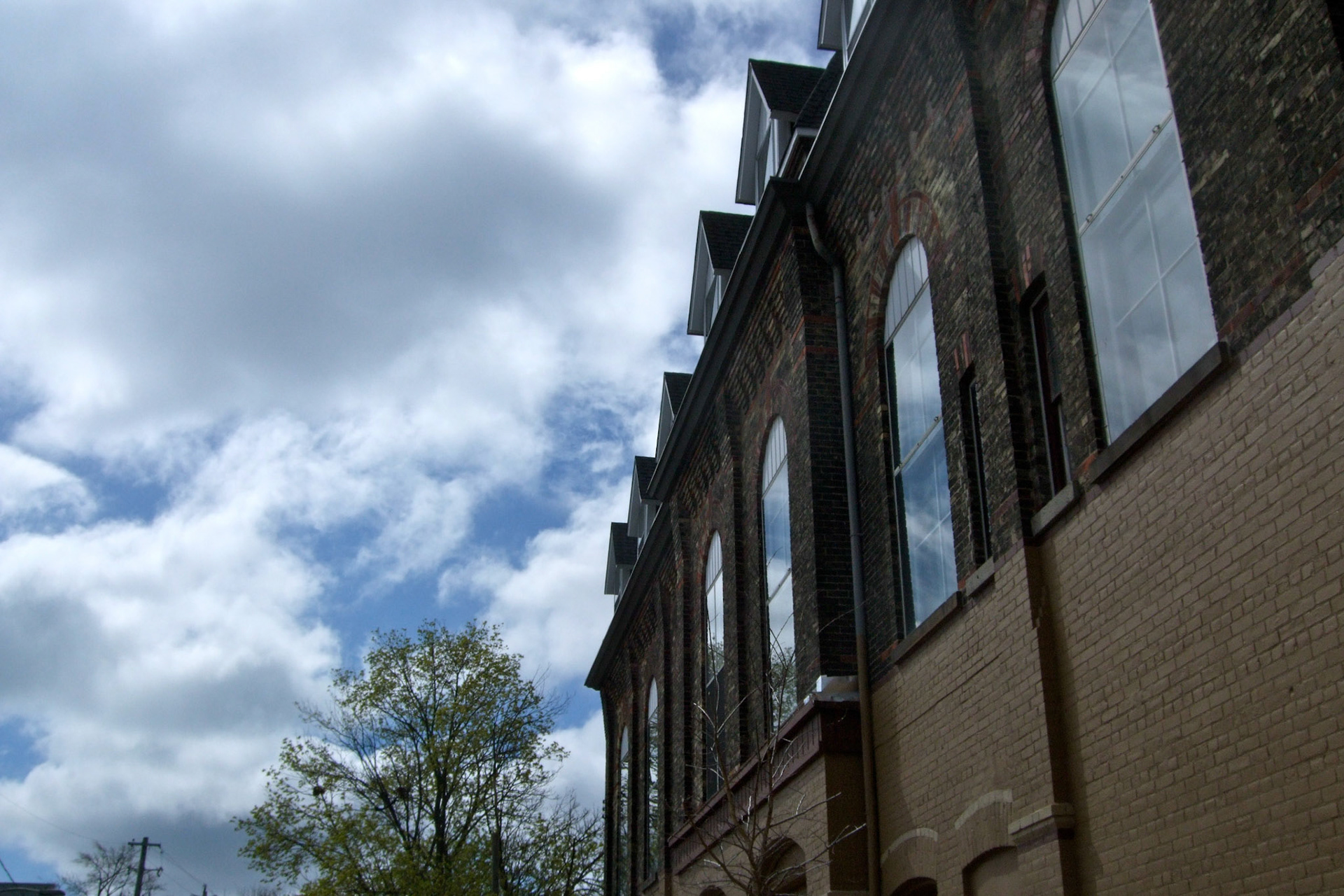 Clouds reflect in the Aeolian Hall's windows