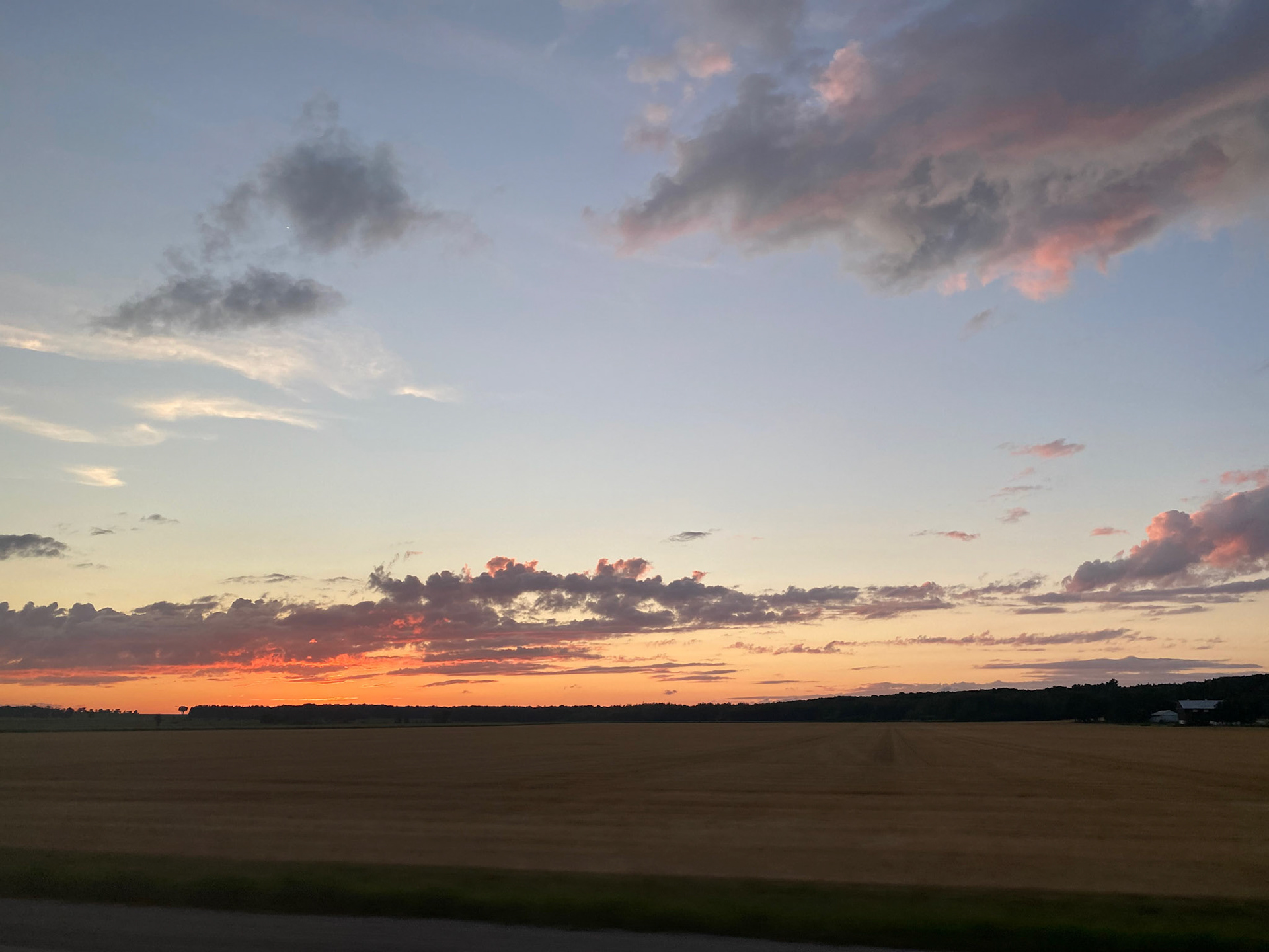 Sun and clouds and sunset during ride to the cottage - July 28-2022