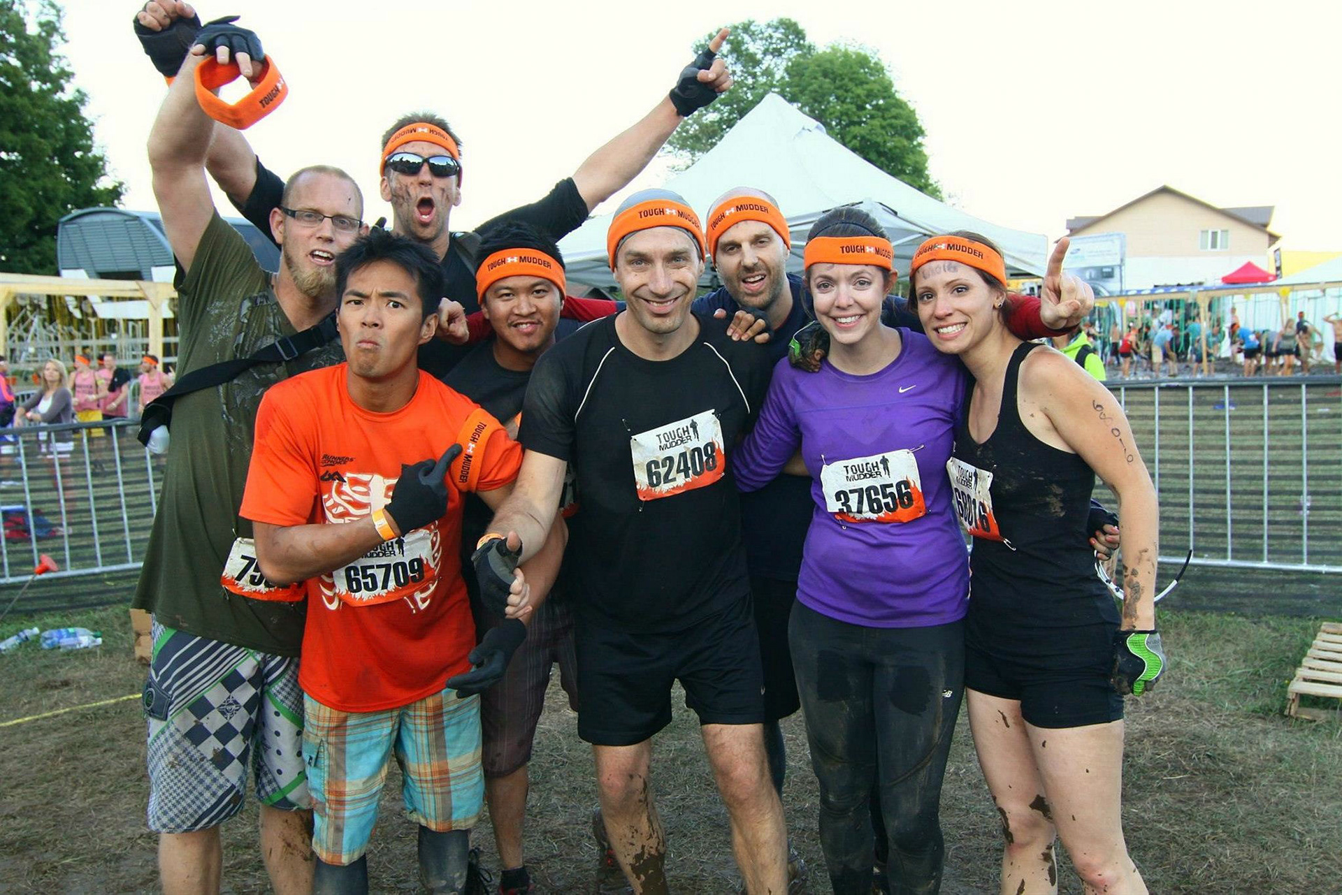 My Tough Mudder team at the finish line with our hard-earned orange headbands:  pumped from the hardest challenge ever