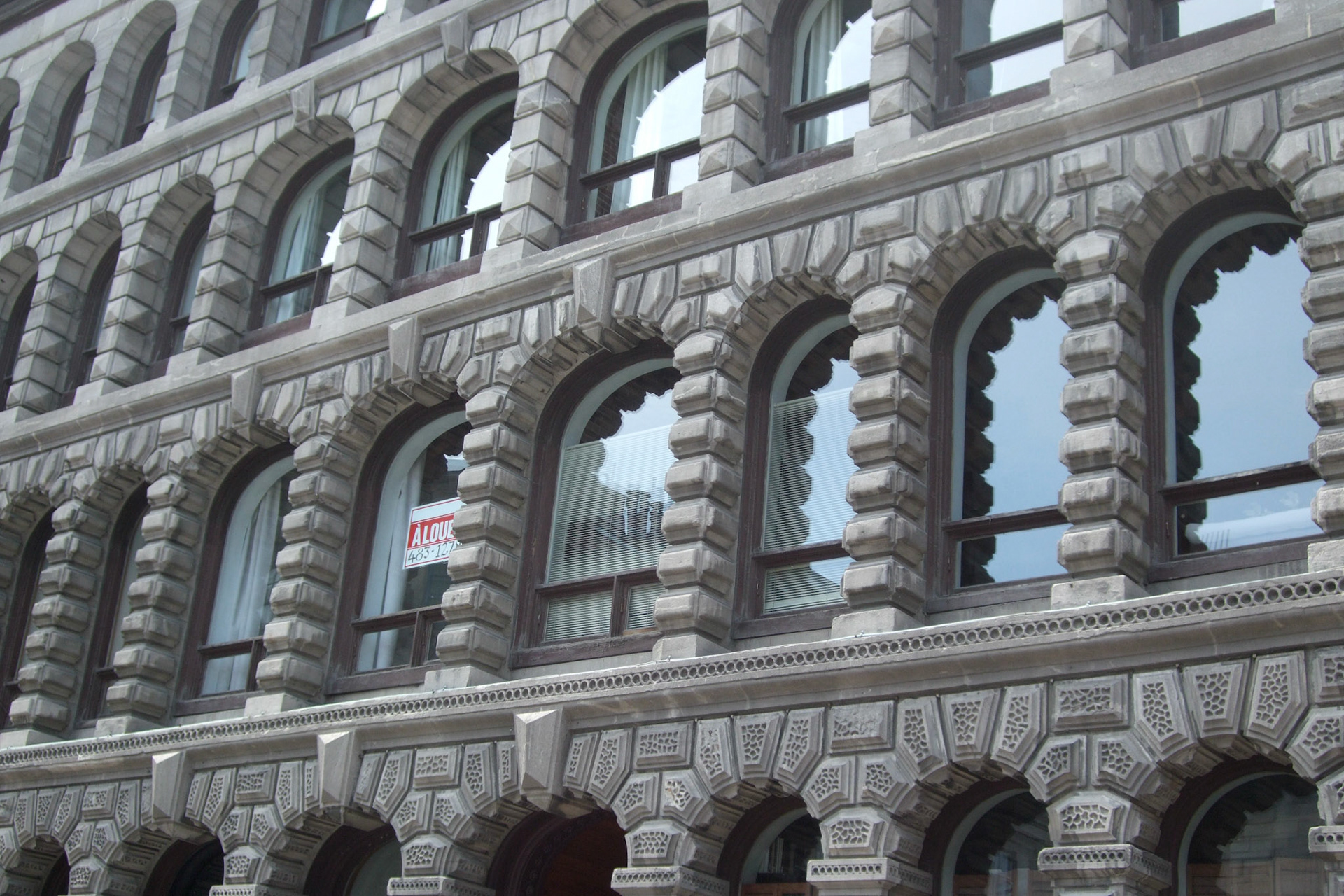 Row upon row of arched windows in Old Montreal