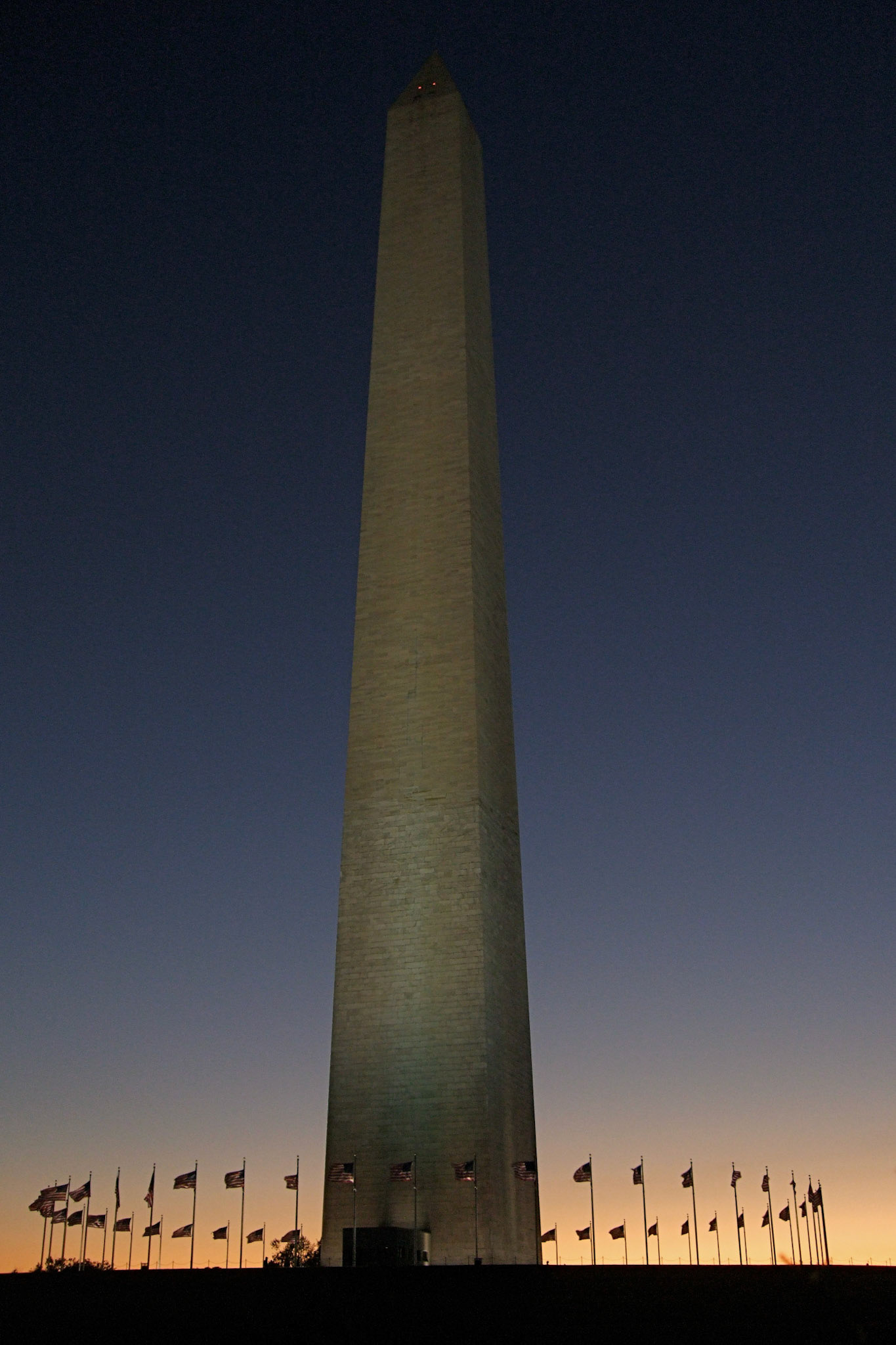 Back on the ground, the sun sets behind the Washington Monument