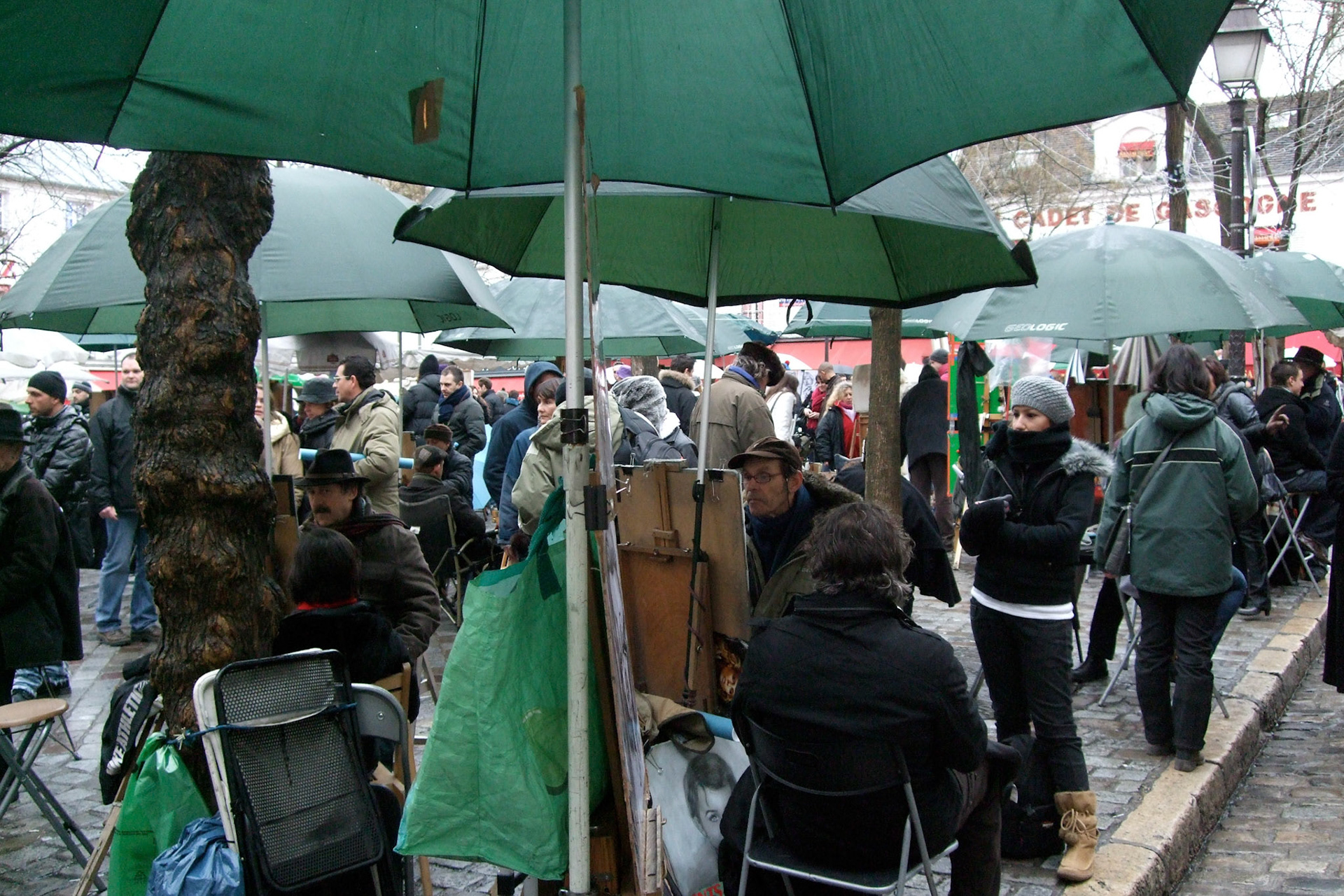 There square is filled with artists painting charactactures