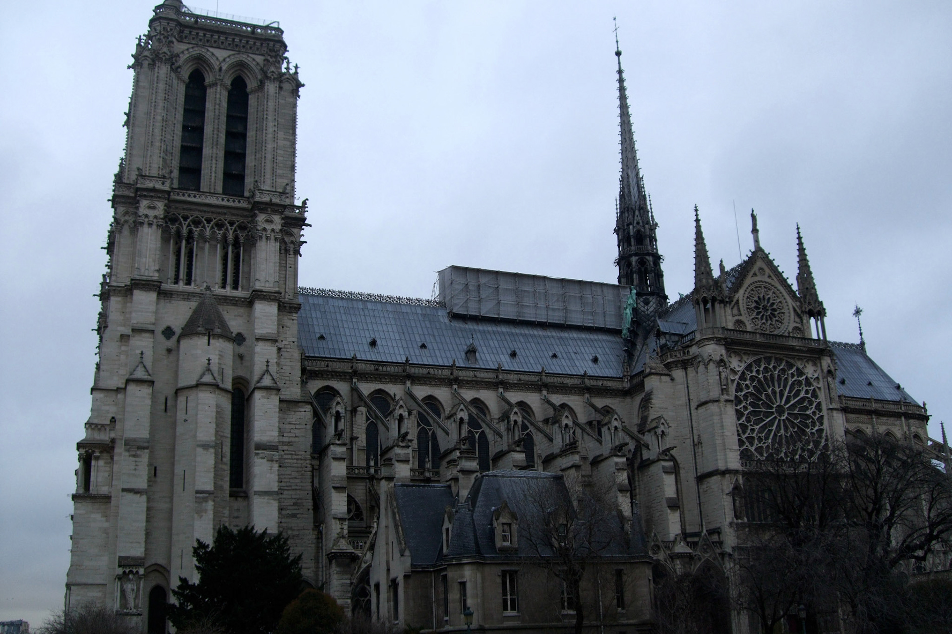 Side view of Notre Dame, showing one of the famous rose windows and flying buttresses