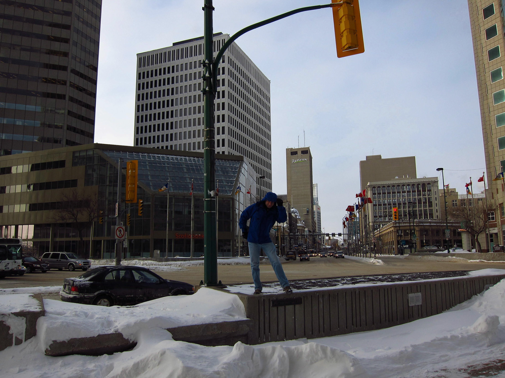 Bracing against the wind at Portage and Main: known as the coldest and windiest intersection in Canada