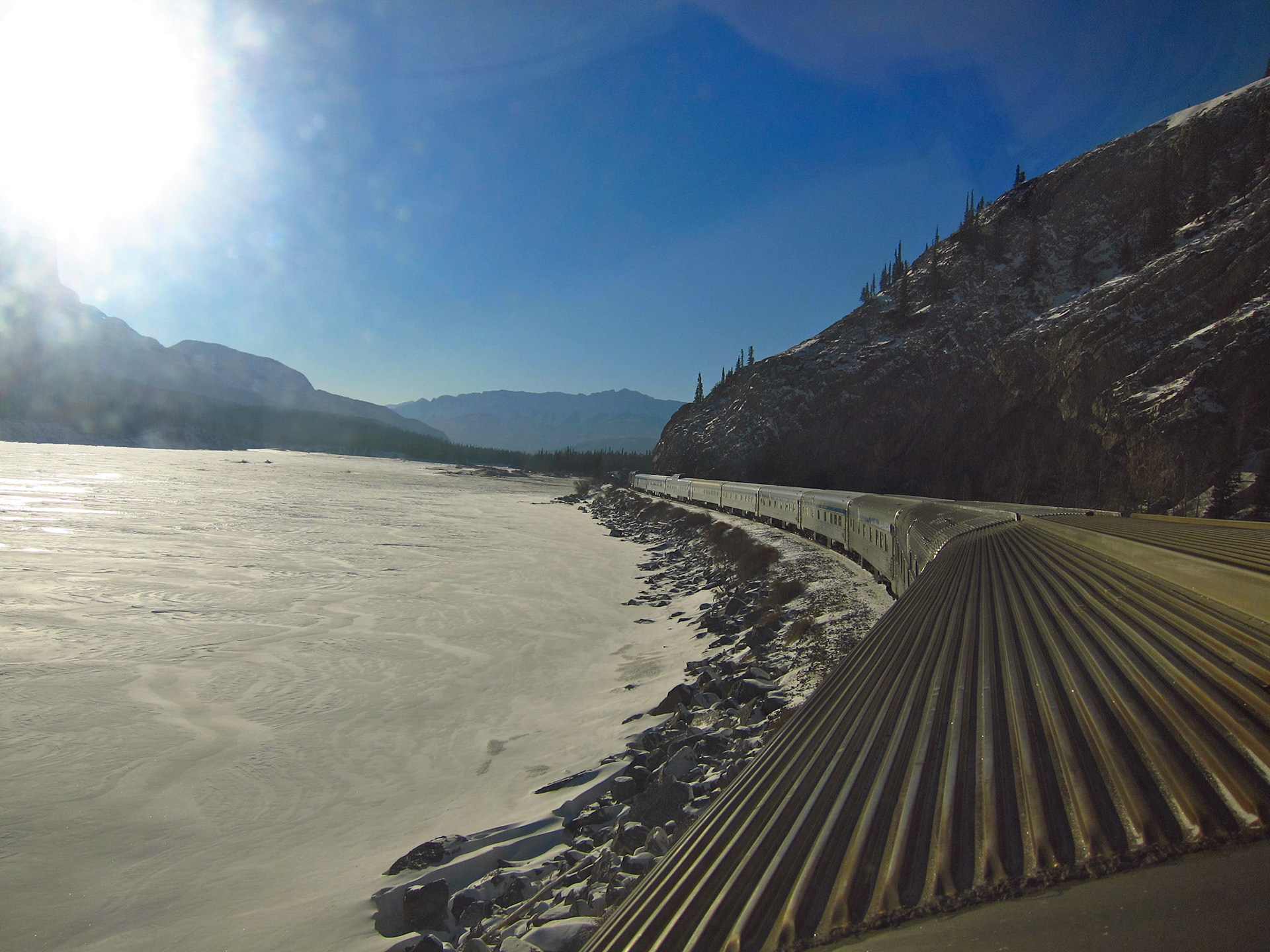 The Canadian passing by a mountain river near Jasper