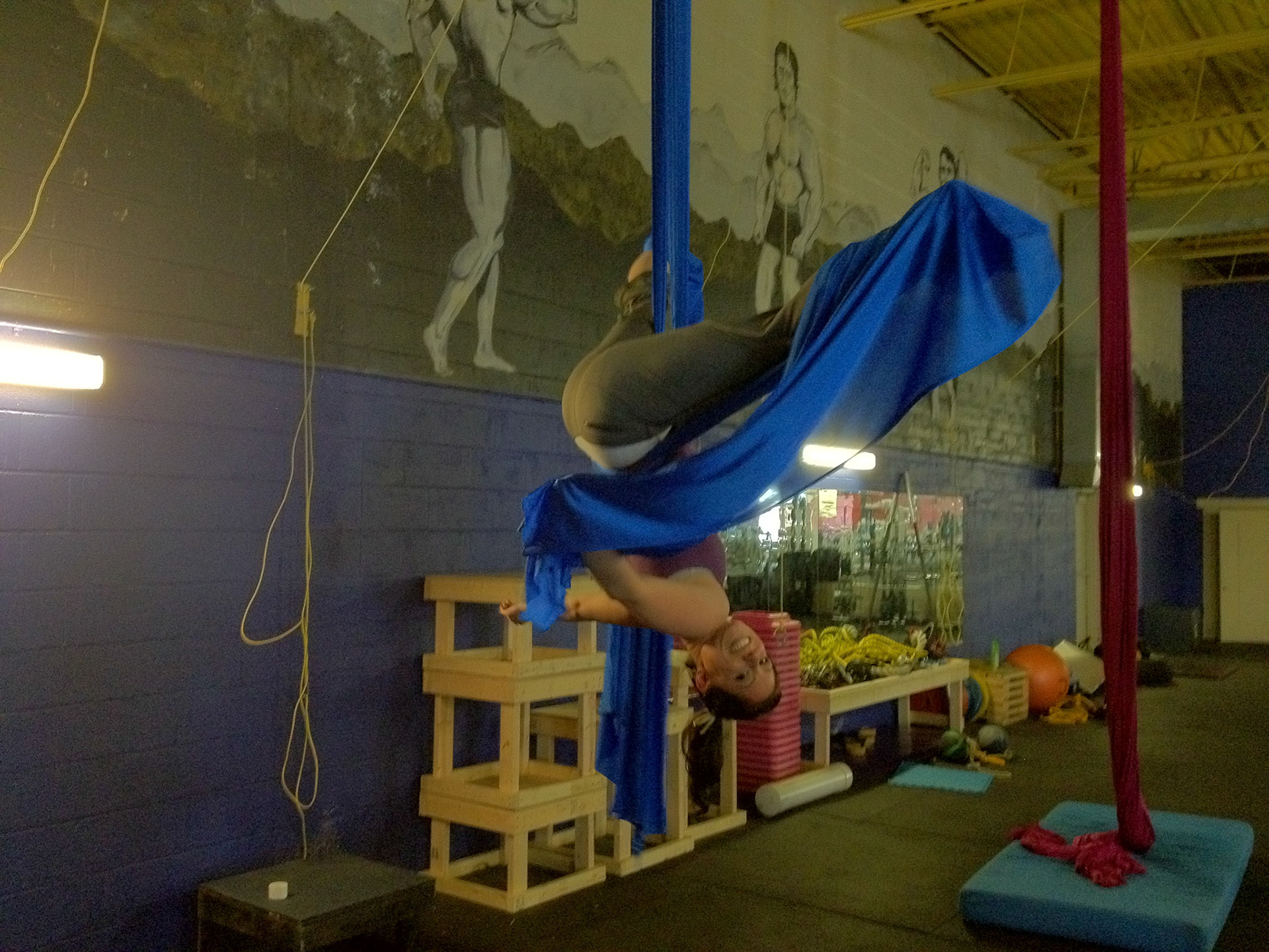 Megan does an inverted aerial move