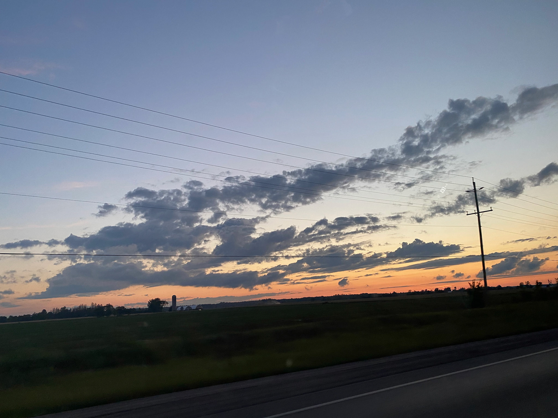 Sun and clouds and sunset during ride to the cottage - July 28-2022