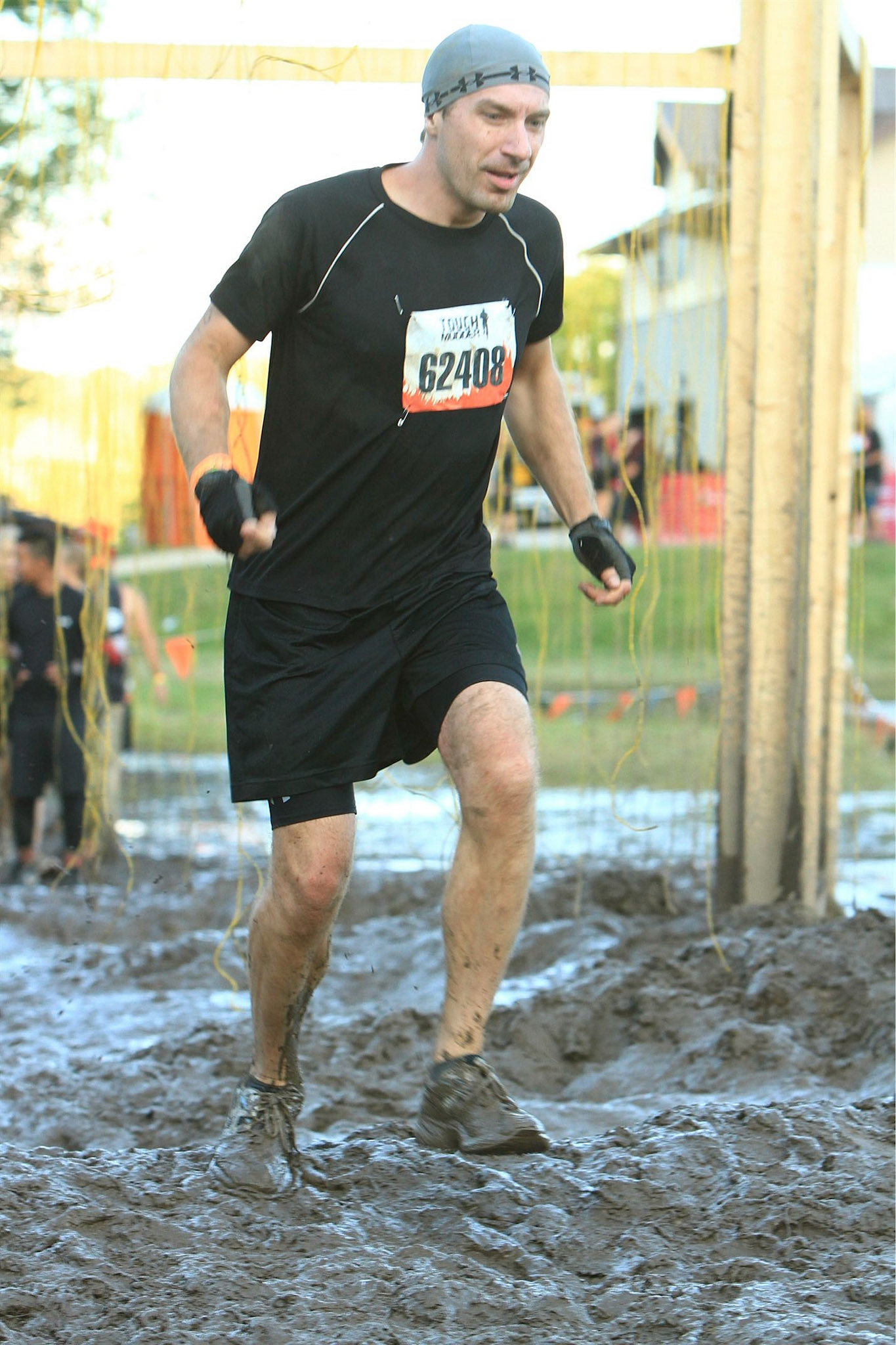 In the thick of Tough Mudder - covered in mud, running through electrified wires. Zap!! Ouch!!