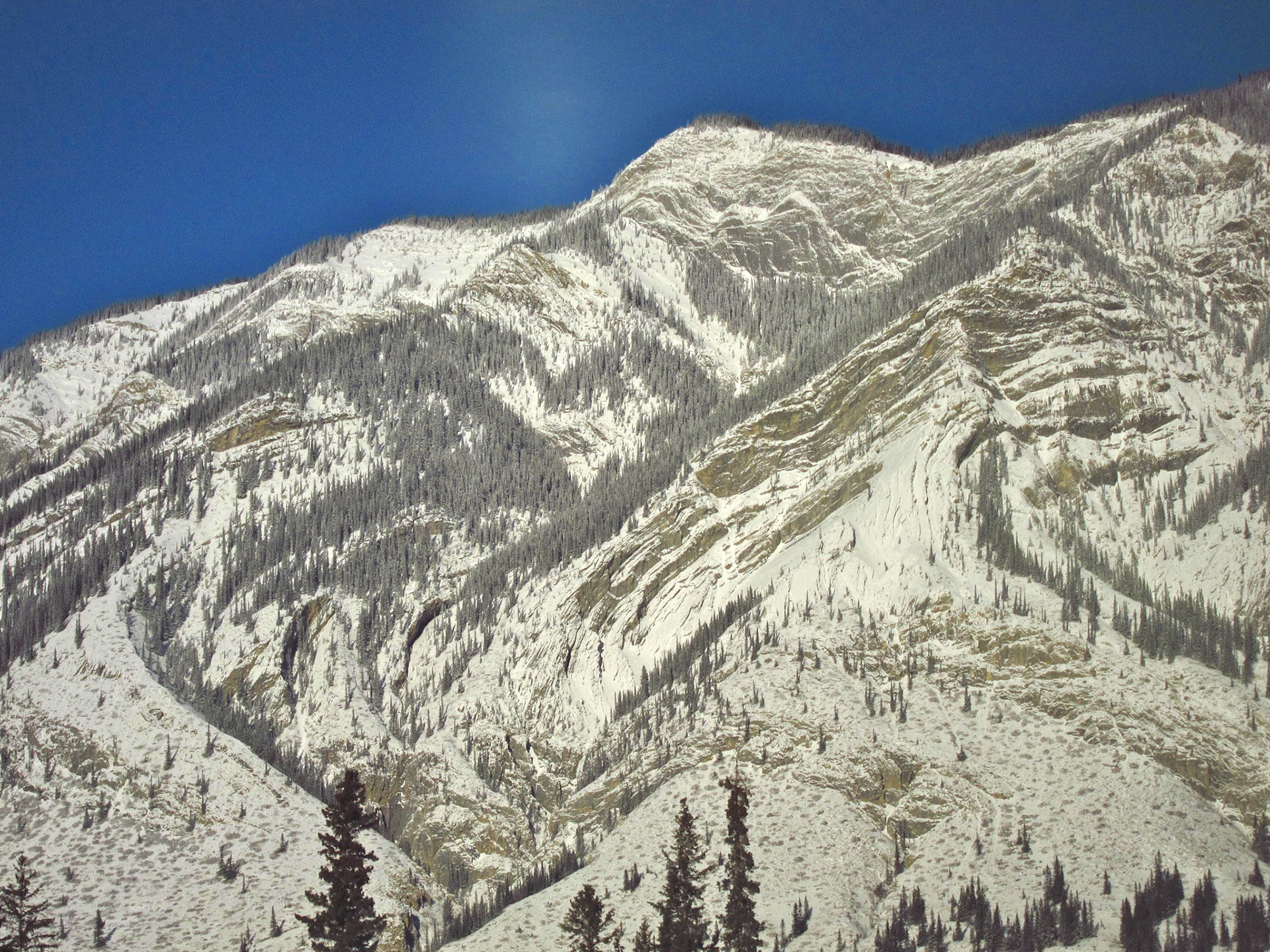 Snow-covered mountain peaks in the Rockies