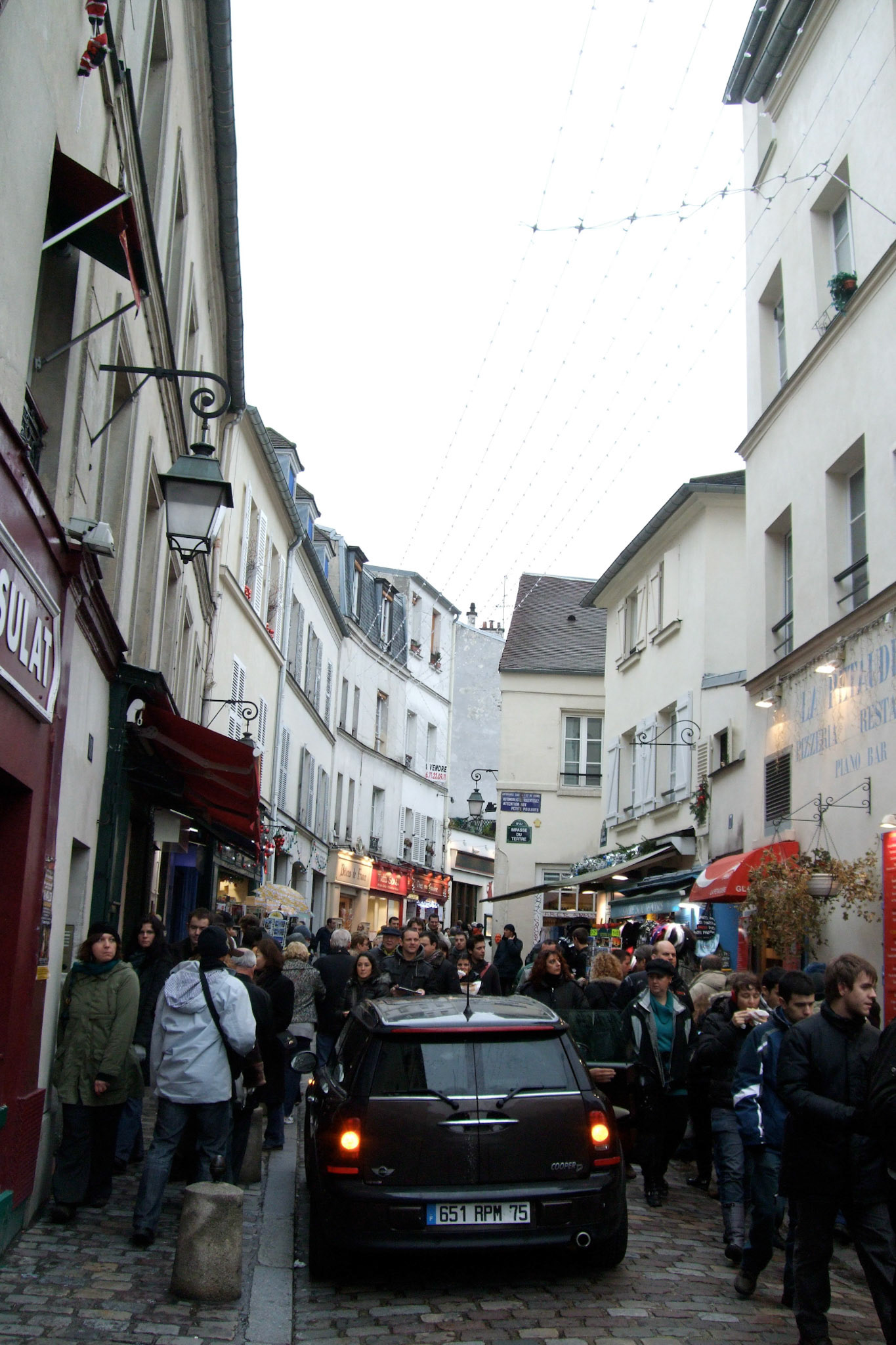 The crowded, beautiful, narrow streets of Montmartre. I couldn't imagine driving down them!