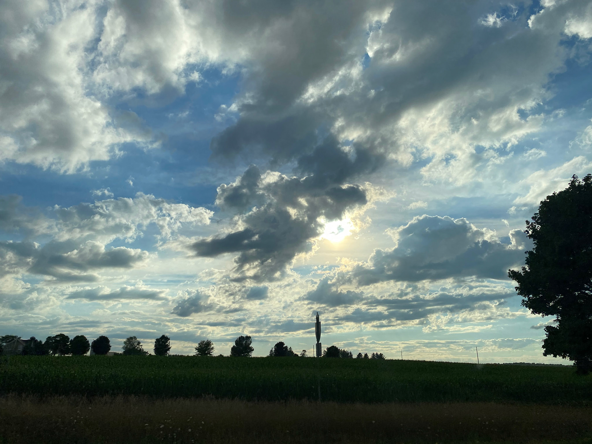 Sun and clouds and sunset during ride to the cottage - July 28-2022