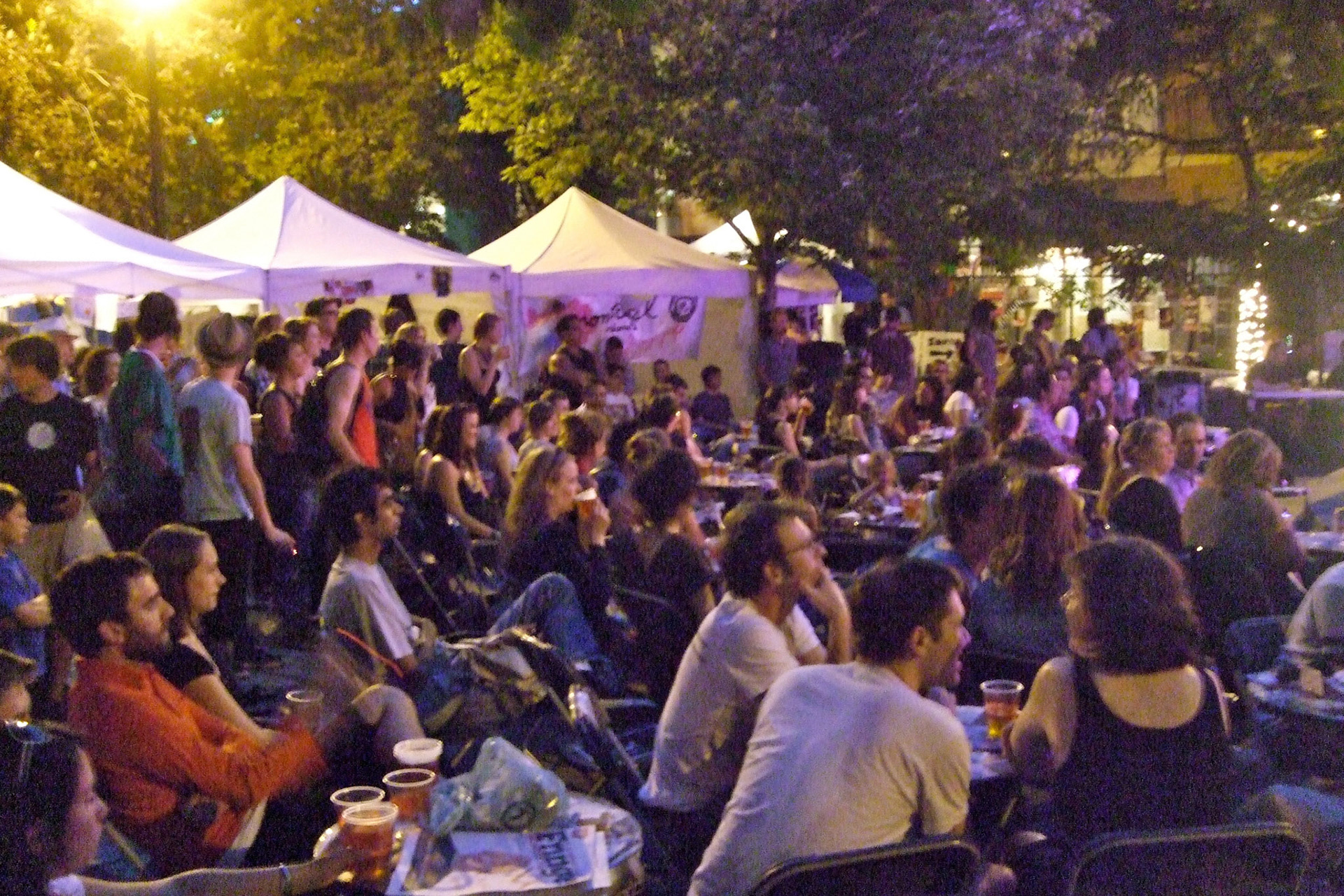 Fringe Festival attendees enjoy the late summer night atmosphere