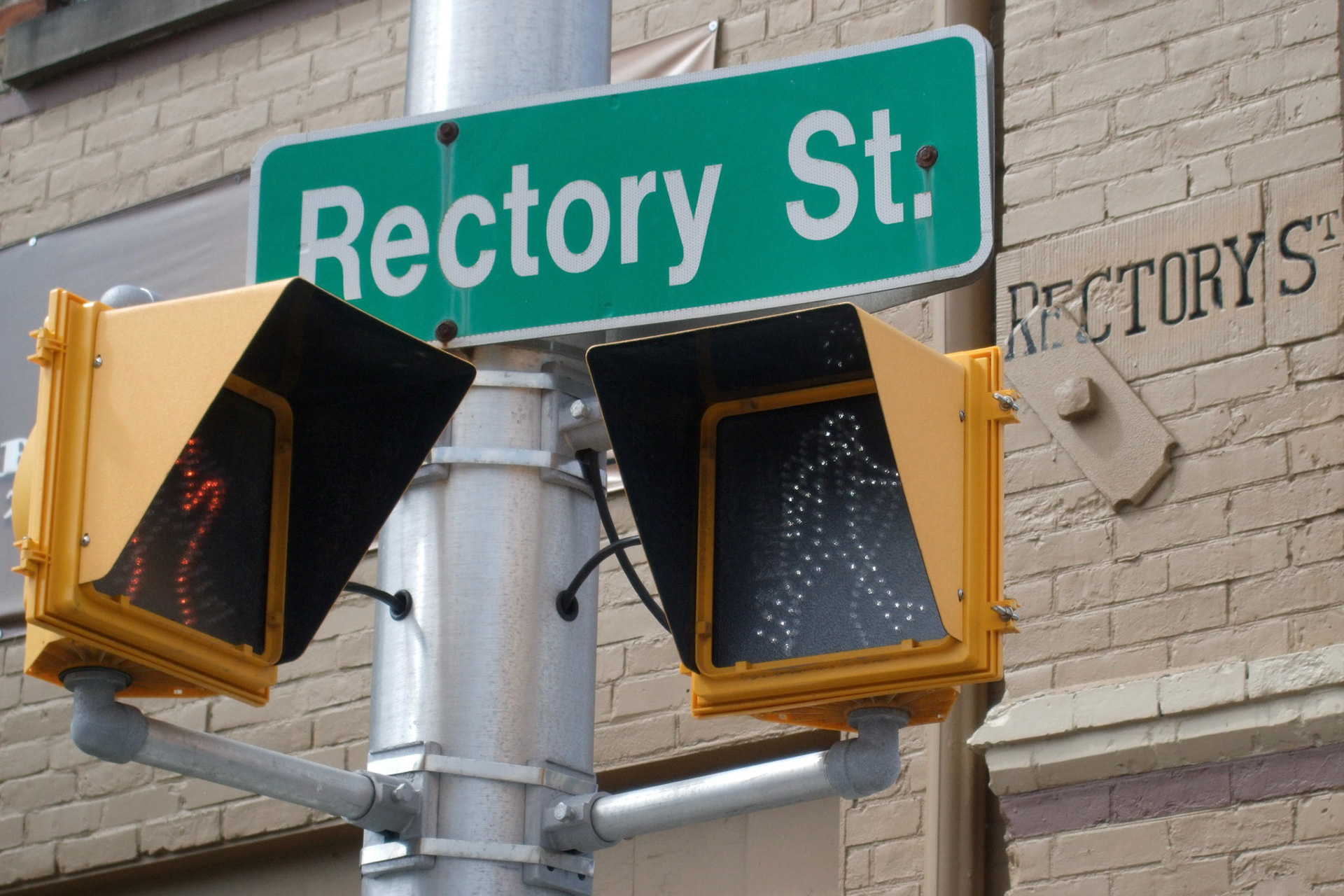 Old and new - the modern street sign with the old Rectory Street marker in the wall of Aeolian Hall