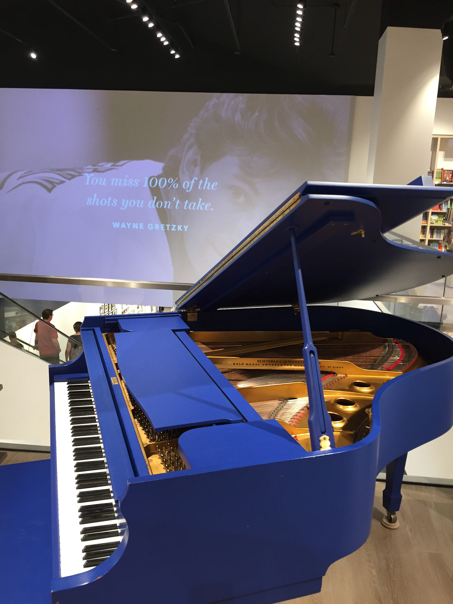 A blue grand piano at Indigo Sherway