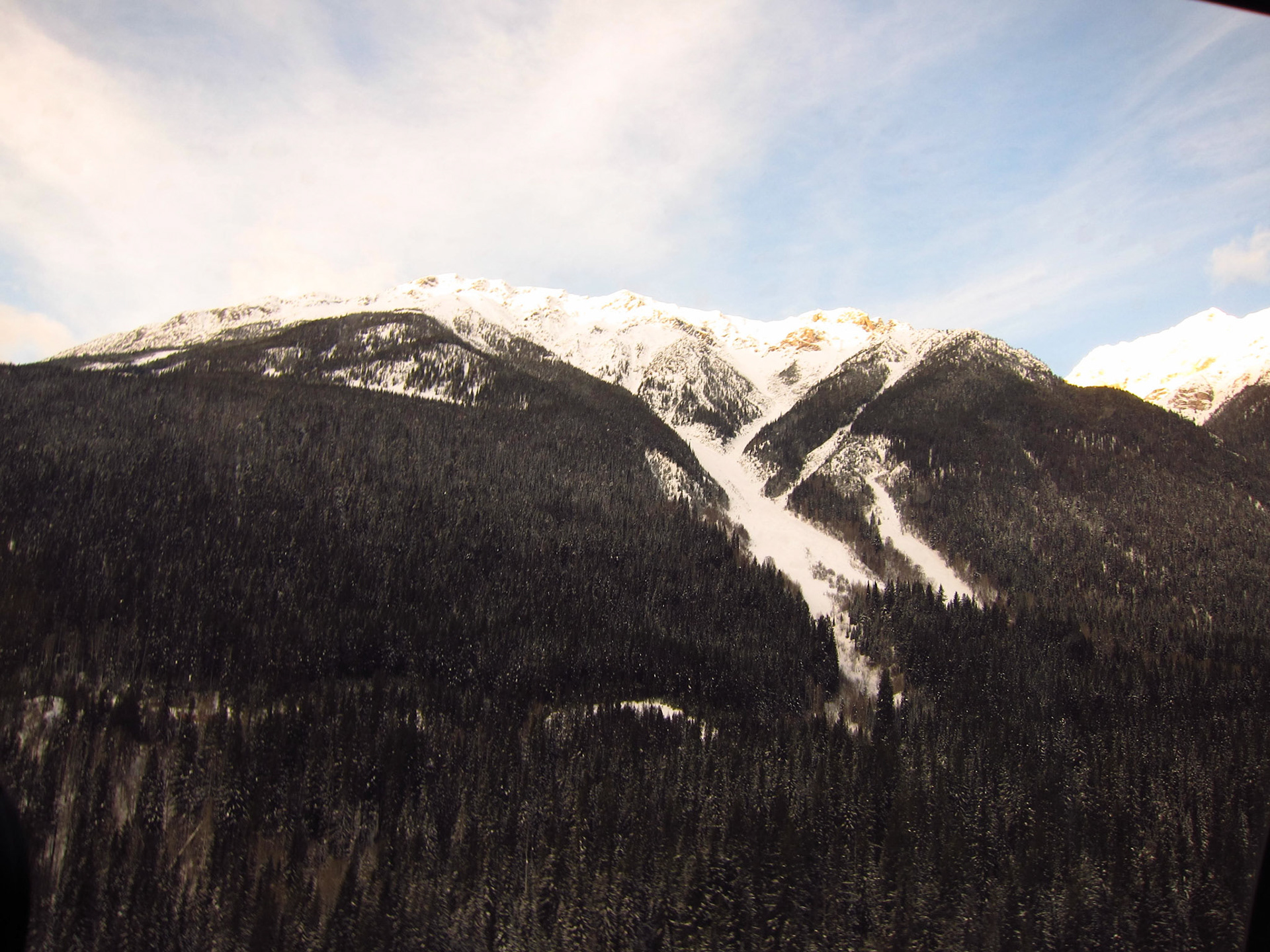 You can see here where an avalanche wiped out a patch of trees along the mountain