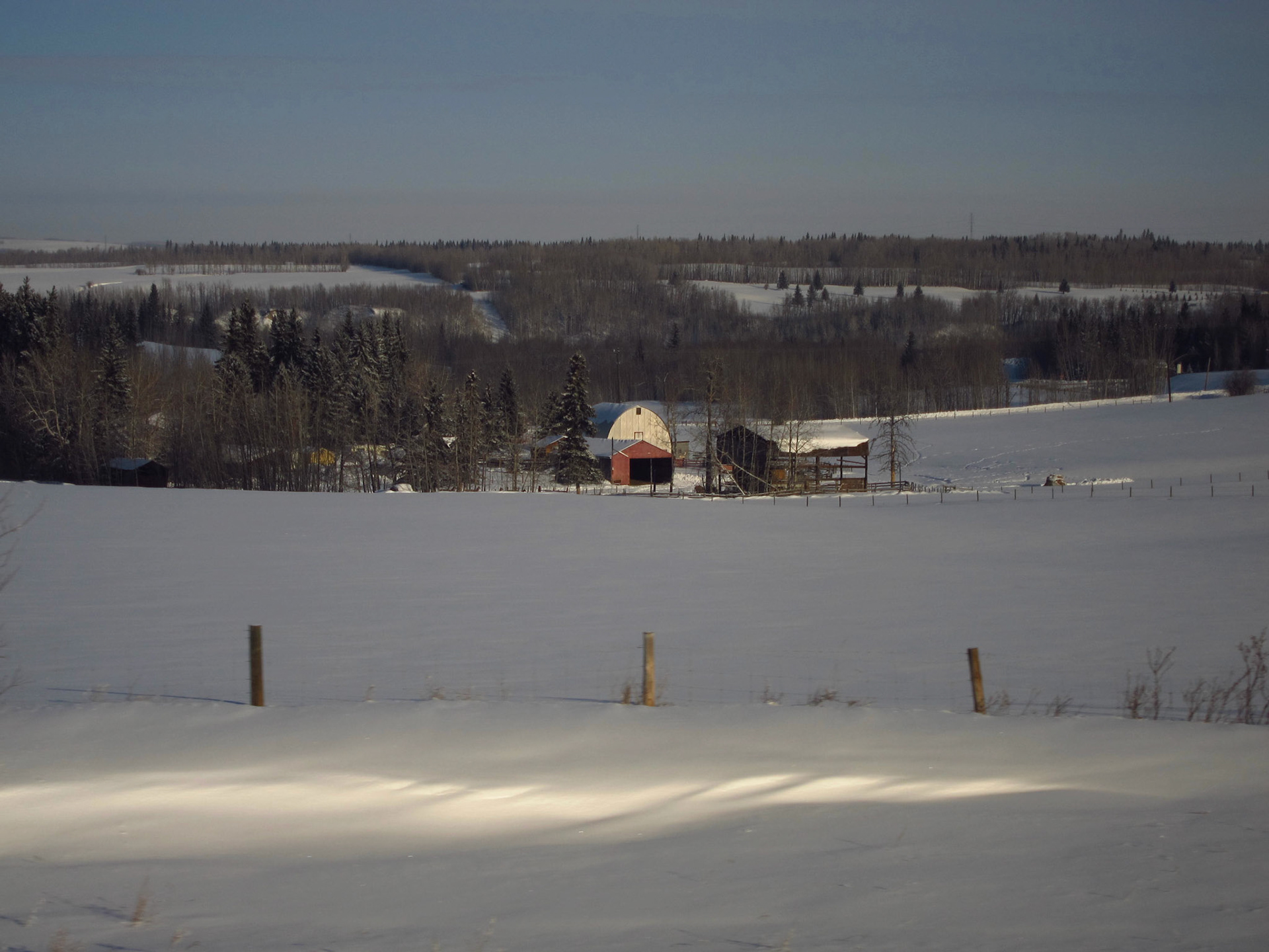 An Alberta ranch. The prairies are starting to give way to more hilly terrain