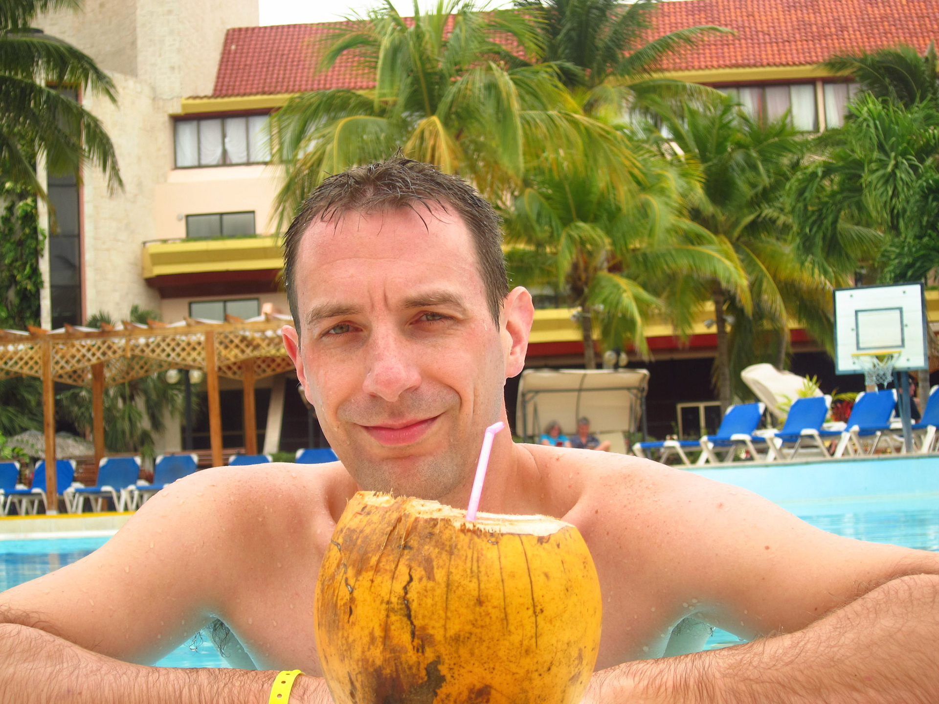 Bliss - enjoying a drink out of a coconut in the pool