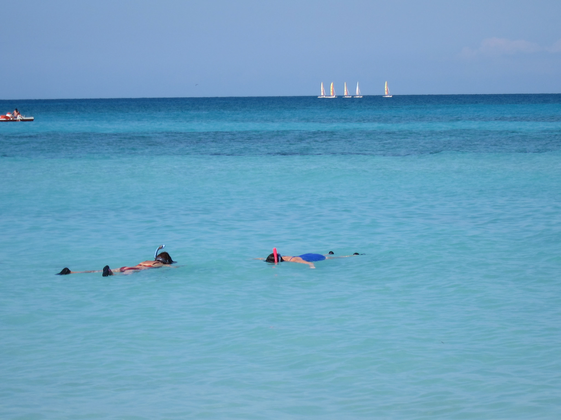 Snorkelers in the crystal blue water