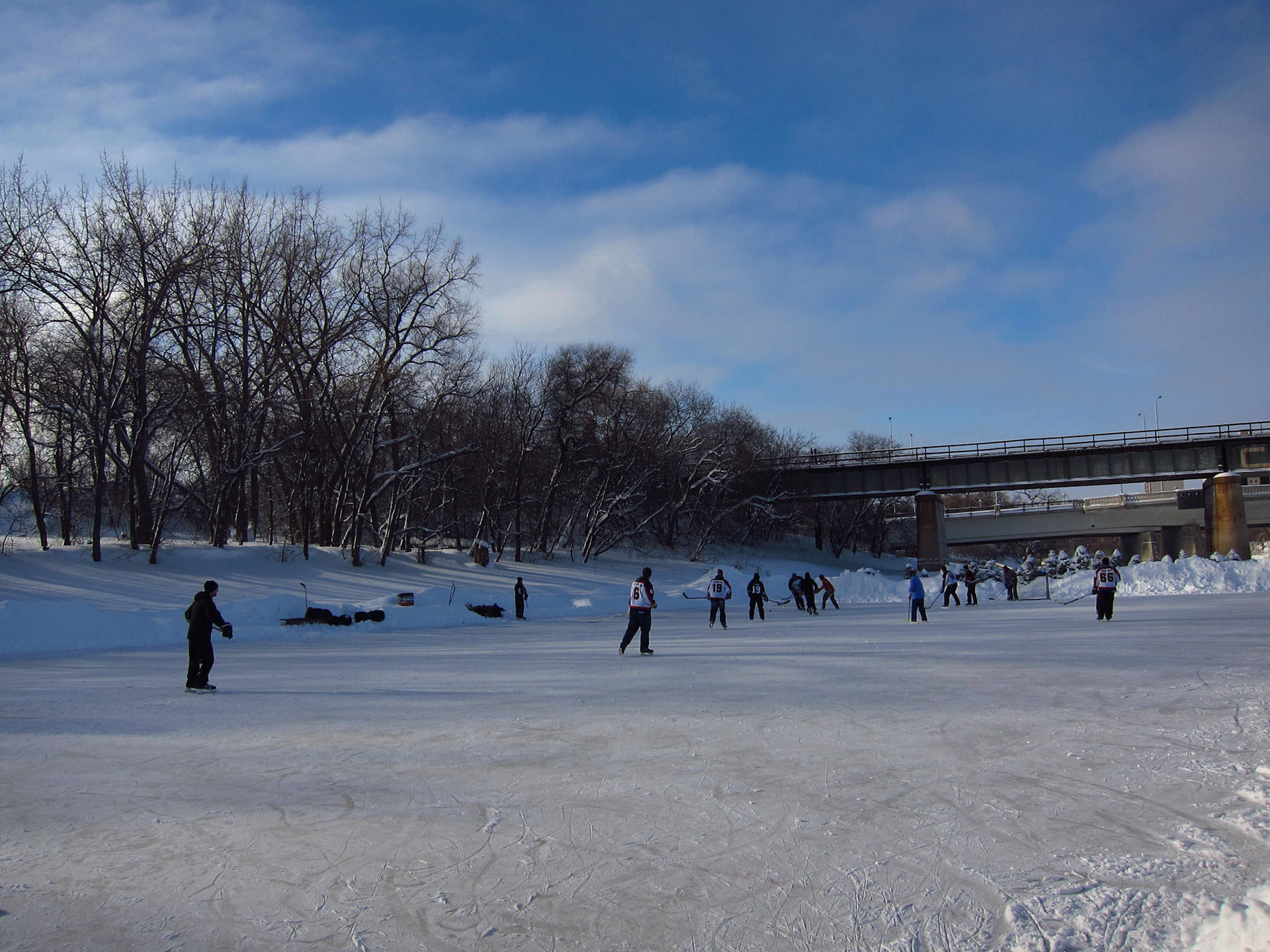 Hockey players on the Assiniboine River in Winnipeg