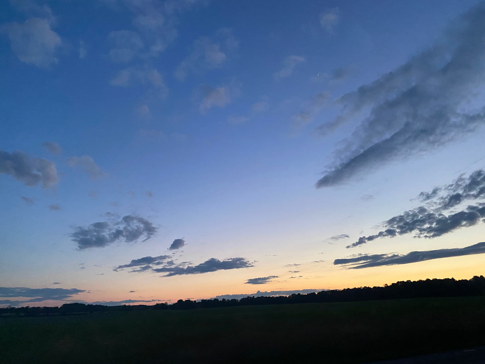 Sun and clouds and sunset during ride to the cottage - July 28-2022