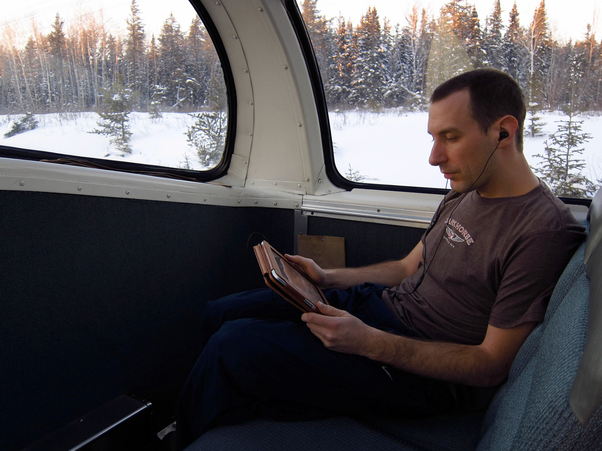 Listening to music and reading in the dome car