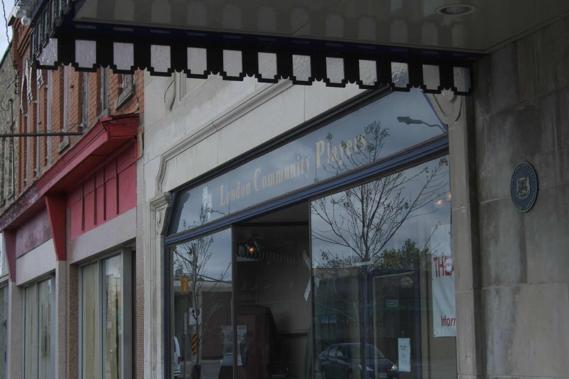 Glass details around the marquee of the Palace Theatre