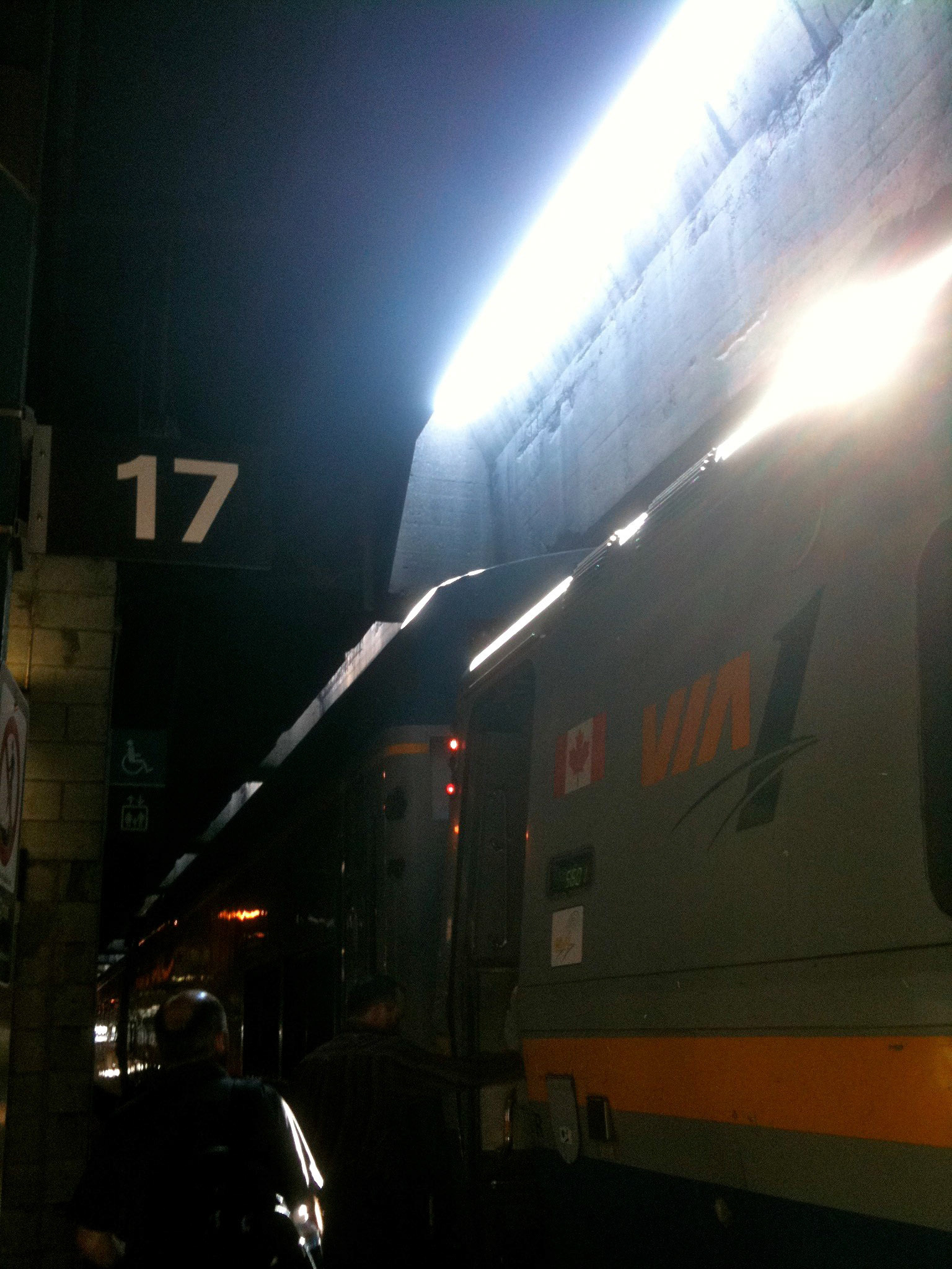 8am train from Toronto to Montreal: the rising sun casts rays on my waiting Via Rail train