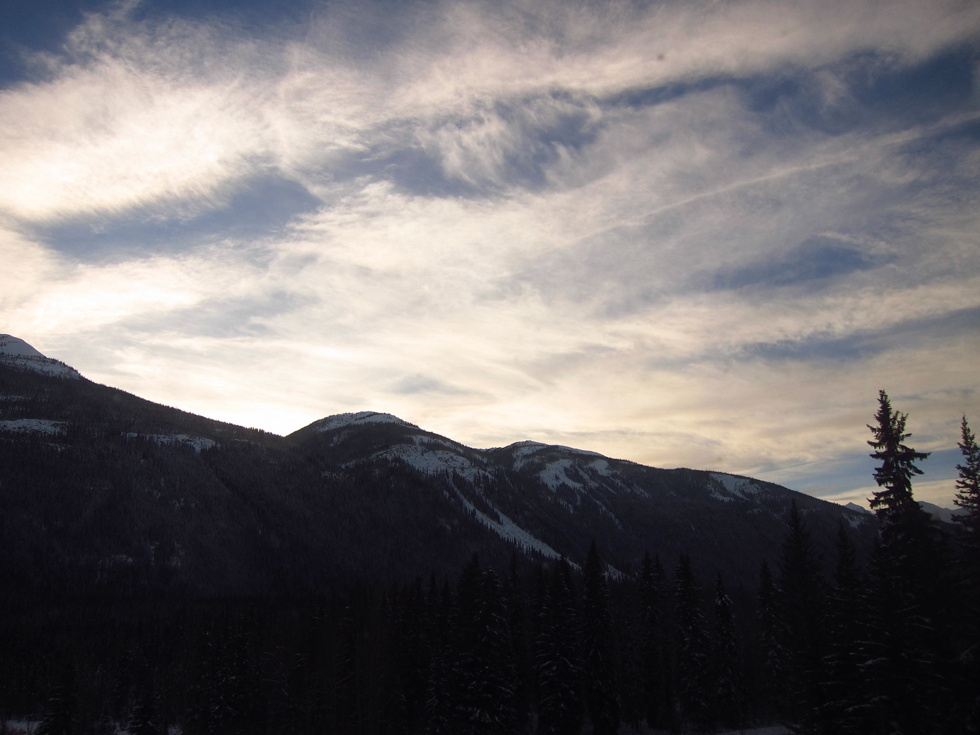 Perfect skies and clouds as we pass through The Rockies