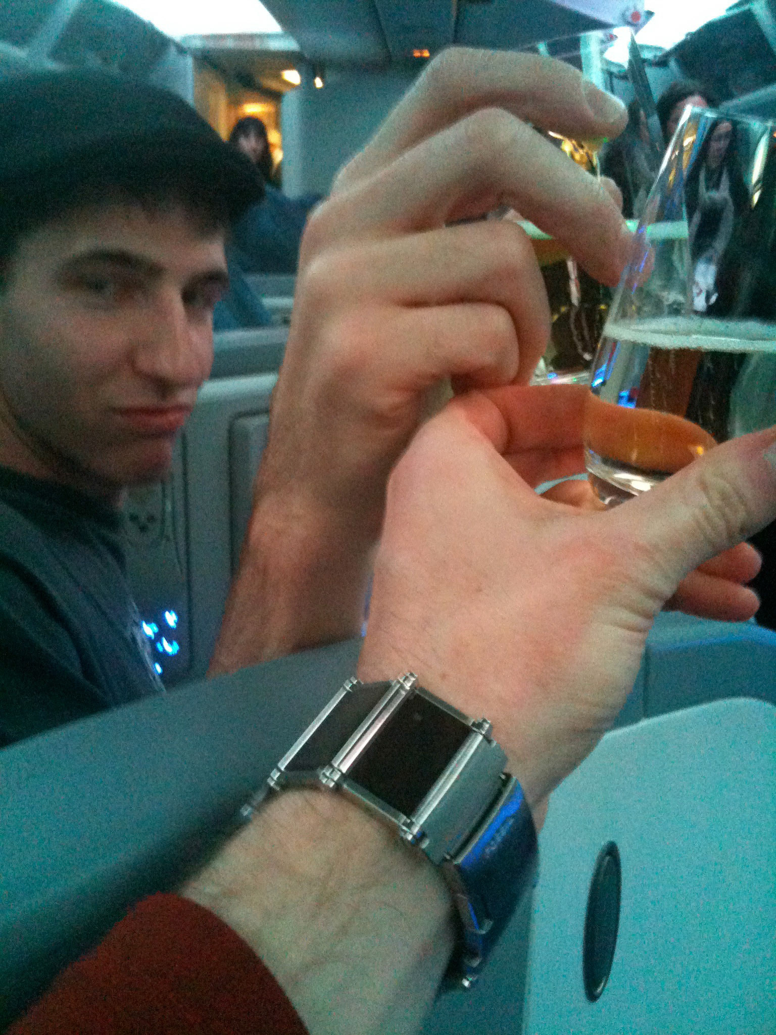 Cheers buddy! Starting our first class flight with a champagne toast