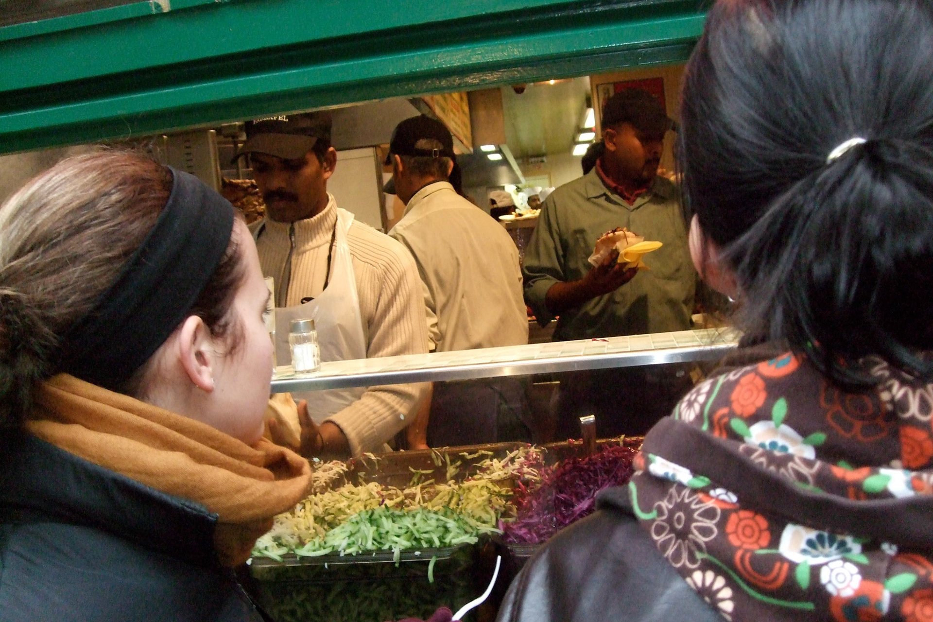 Mara and Tamara anxiously wait for their fallafels