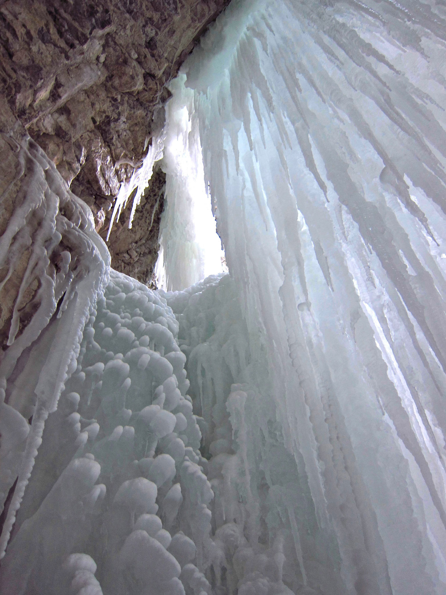 Ice towers overhead in Maligne Canyon