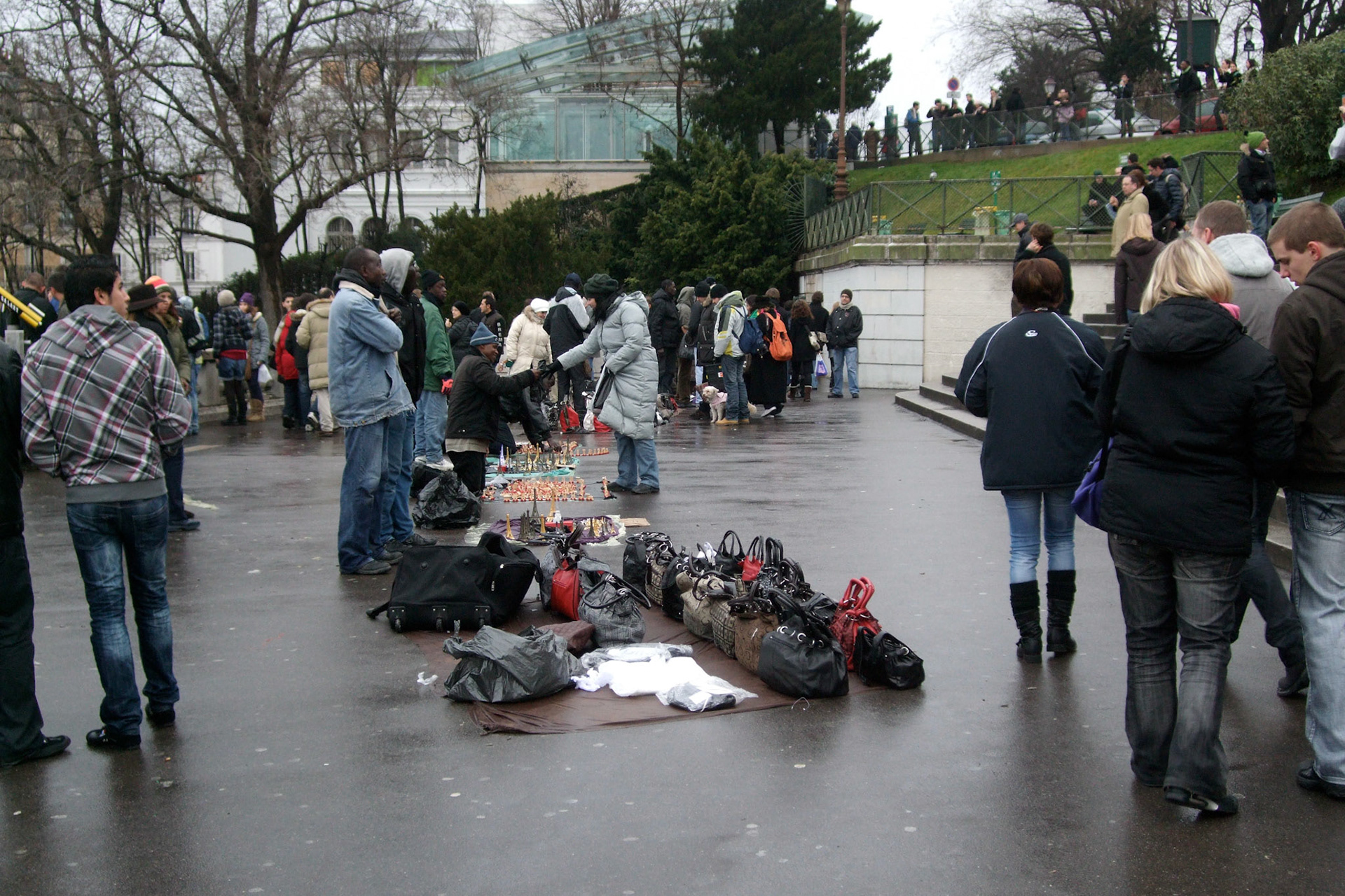 All along the steps and plateaus of Sacre Coeur are "salespeople" trying to rip off tourists. They're very aggressive