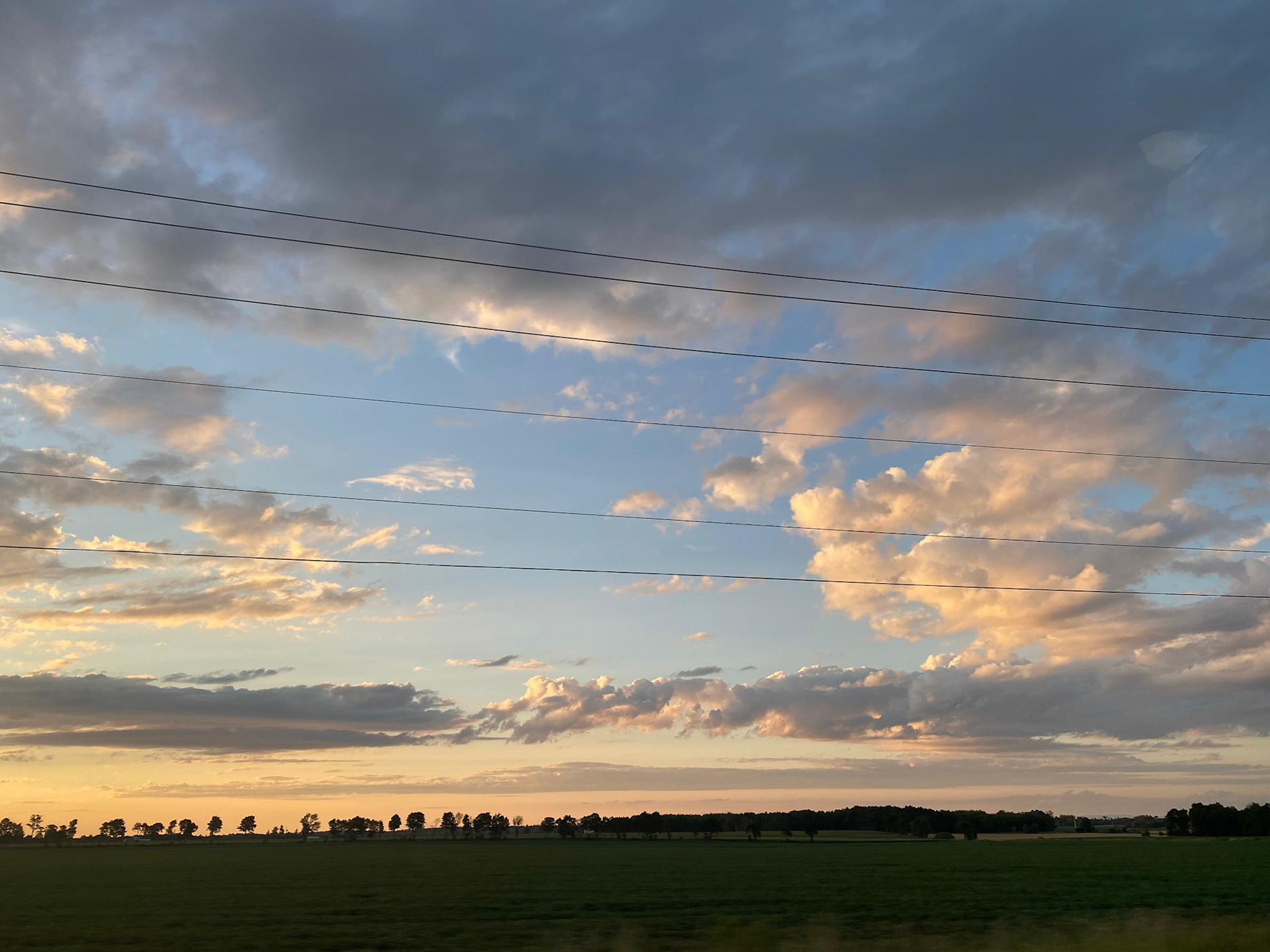 Sun and clouds and sunset during ride to the cottage - July 28-2022