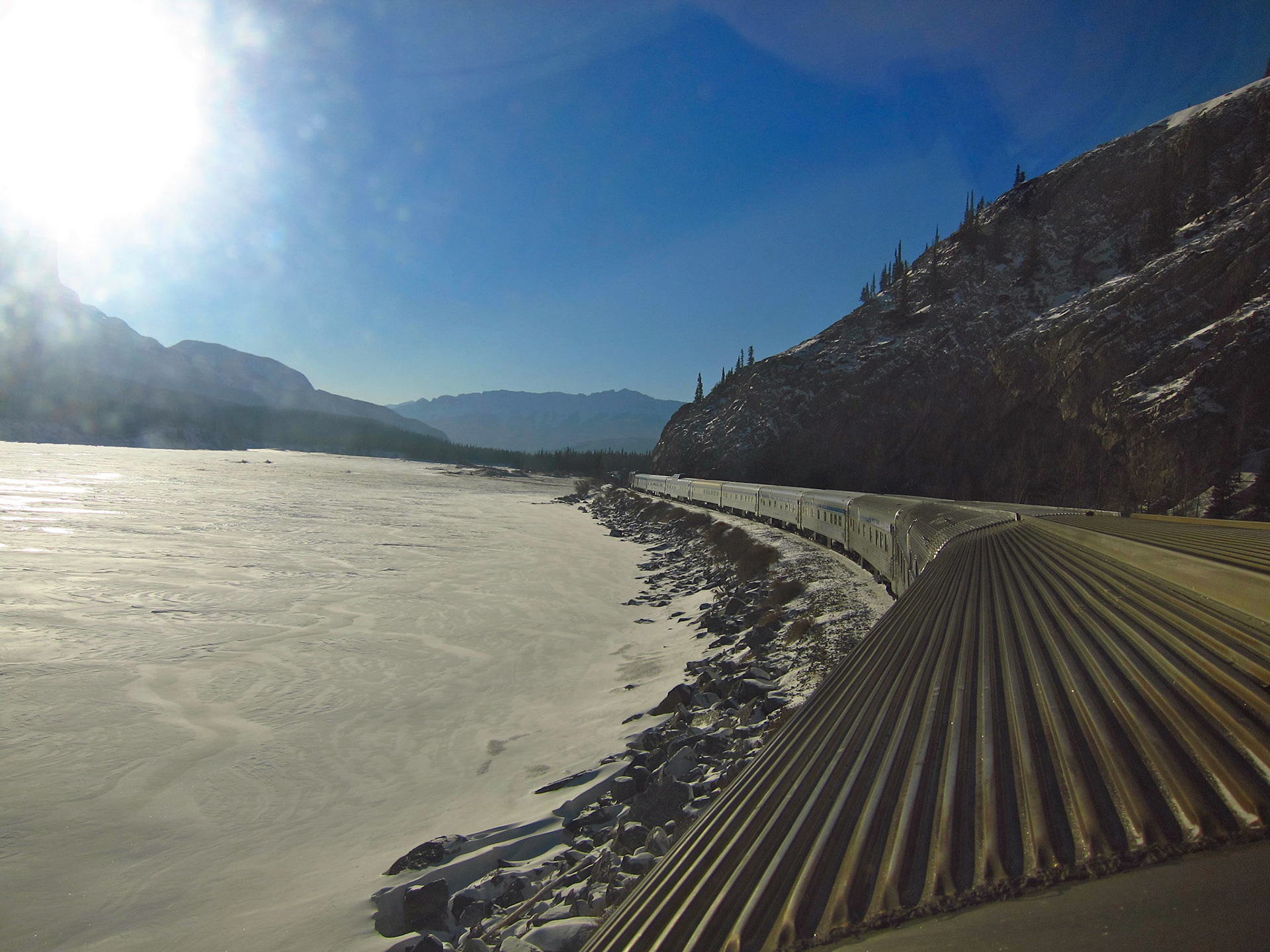 The Canadian passing by a mountain river near Jasper