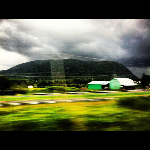 Storm clouds around the mountains: gorgeous backdrop as my @Via_Rail journey continues to Quebec City